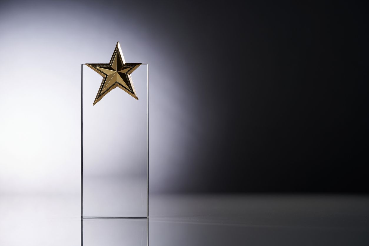 An award with a glass star atop
