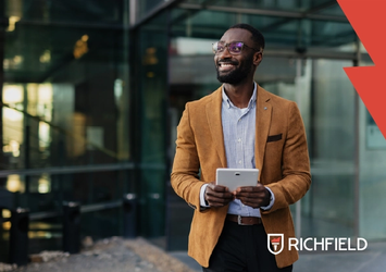 Young professional standing outside an office building