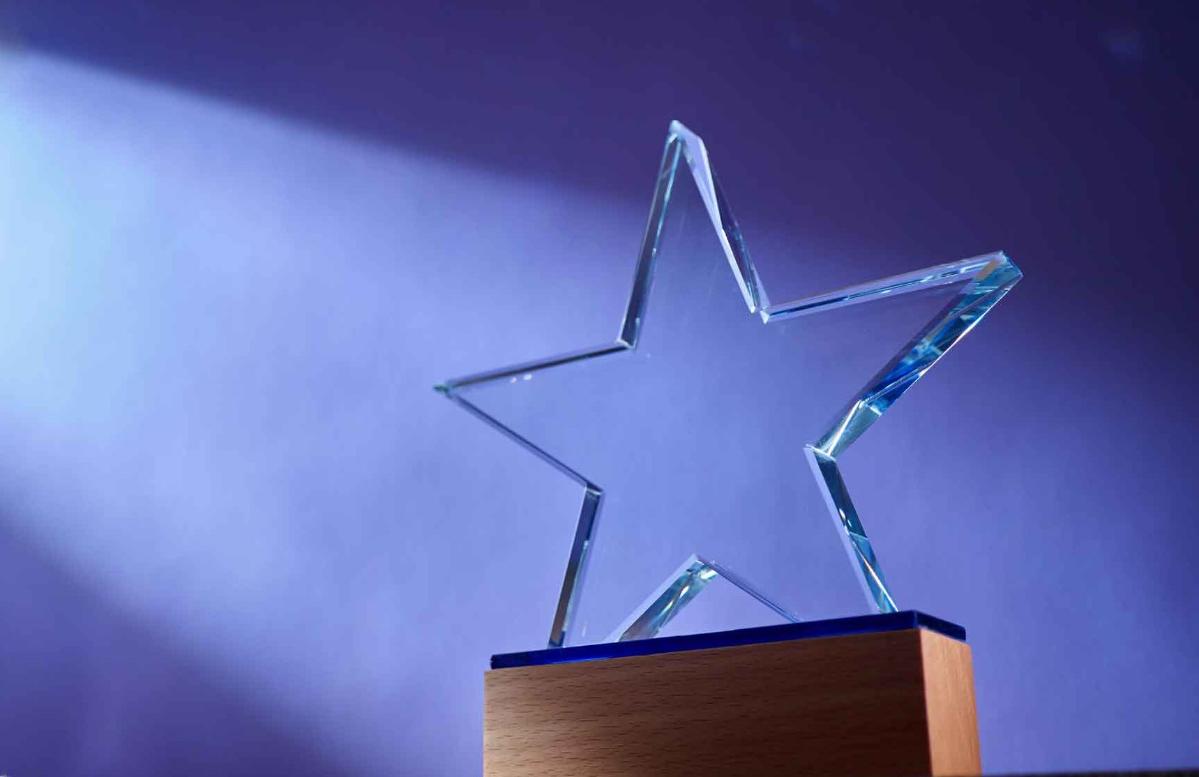 An award with a glass star atop