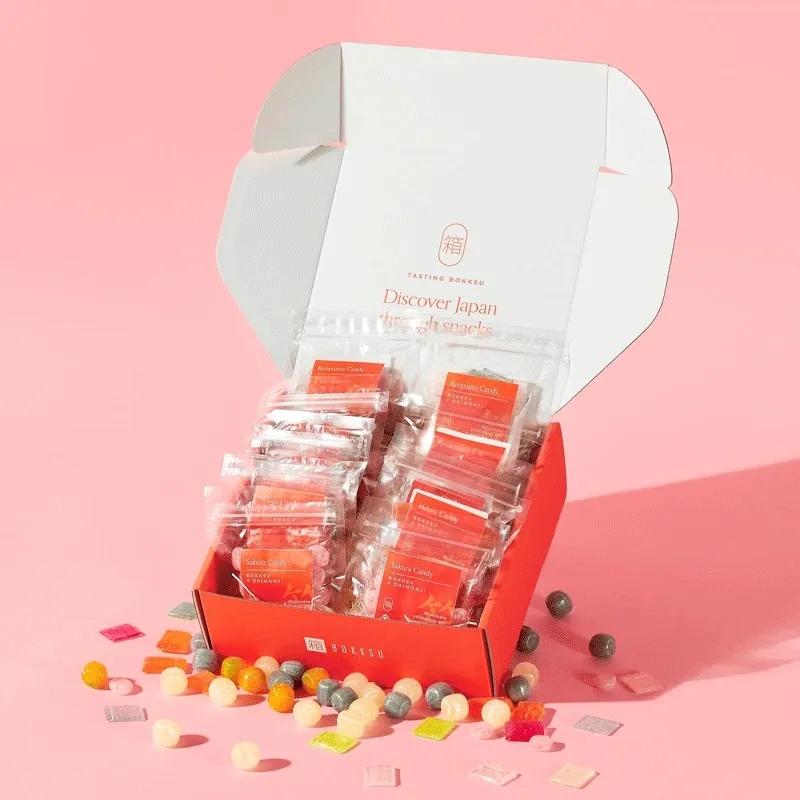 Premium pink candy box with ribbon and floral design