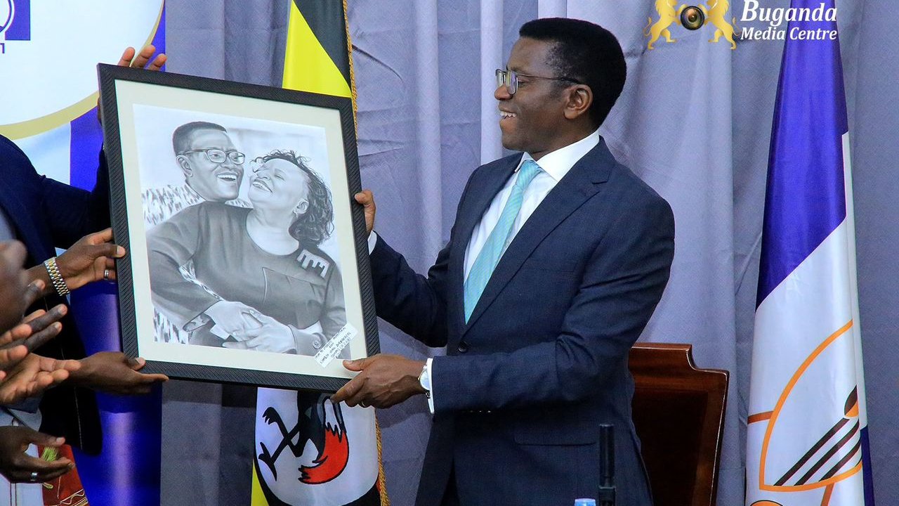 Naalya Secondary Schools Honour Katikiro Mayiga with Artistic Portrait During Courtesy Visit to Bulange Mengo