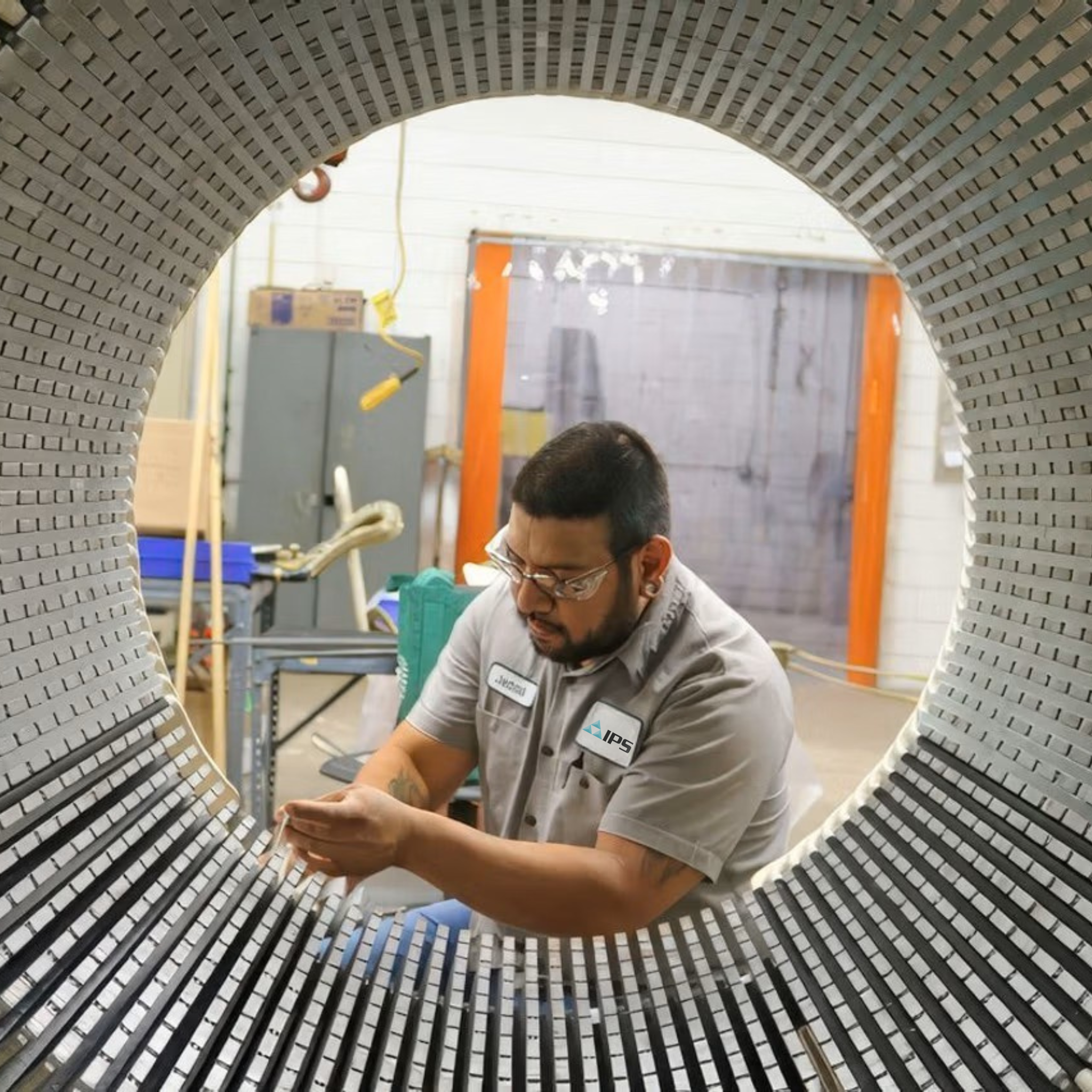 IPS technician inspects the stator core of a large industrial motor.