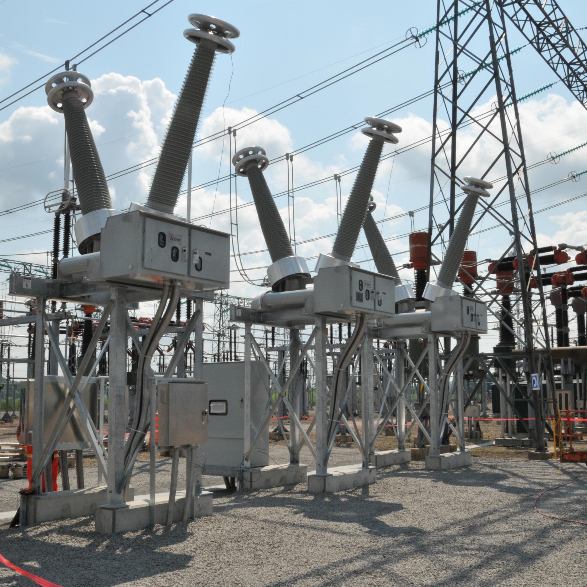 High-voltage circuit breakers, insulators and busbars at an electrical substation