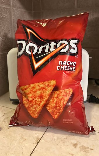 Doritos , Doritos Nacho Cheese Flavored Tortilla Chips 9.25 oz, barcode: 0028400516464, has 9 potentially harmful, 7 questionable, and
    2 added sugar ingredients.
