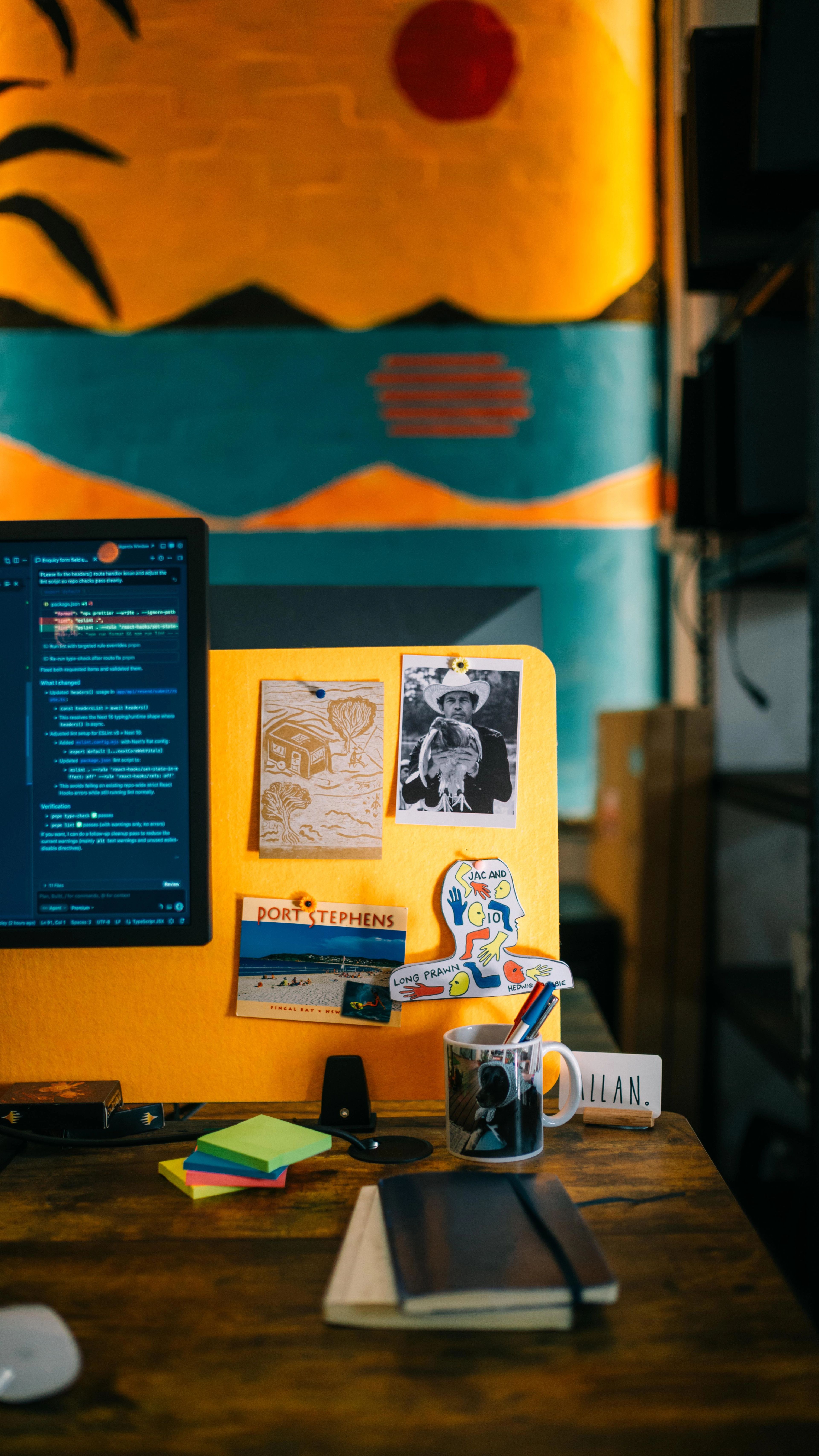A desk with personal belongings and decorations.