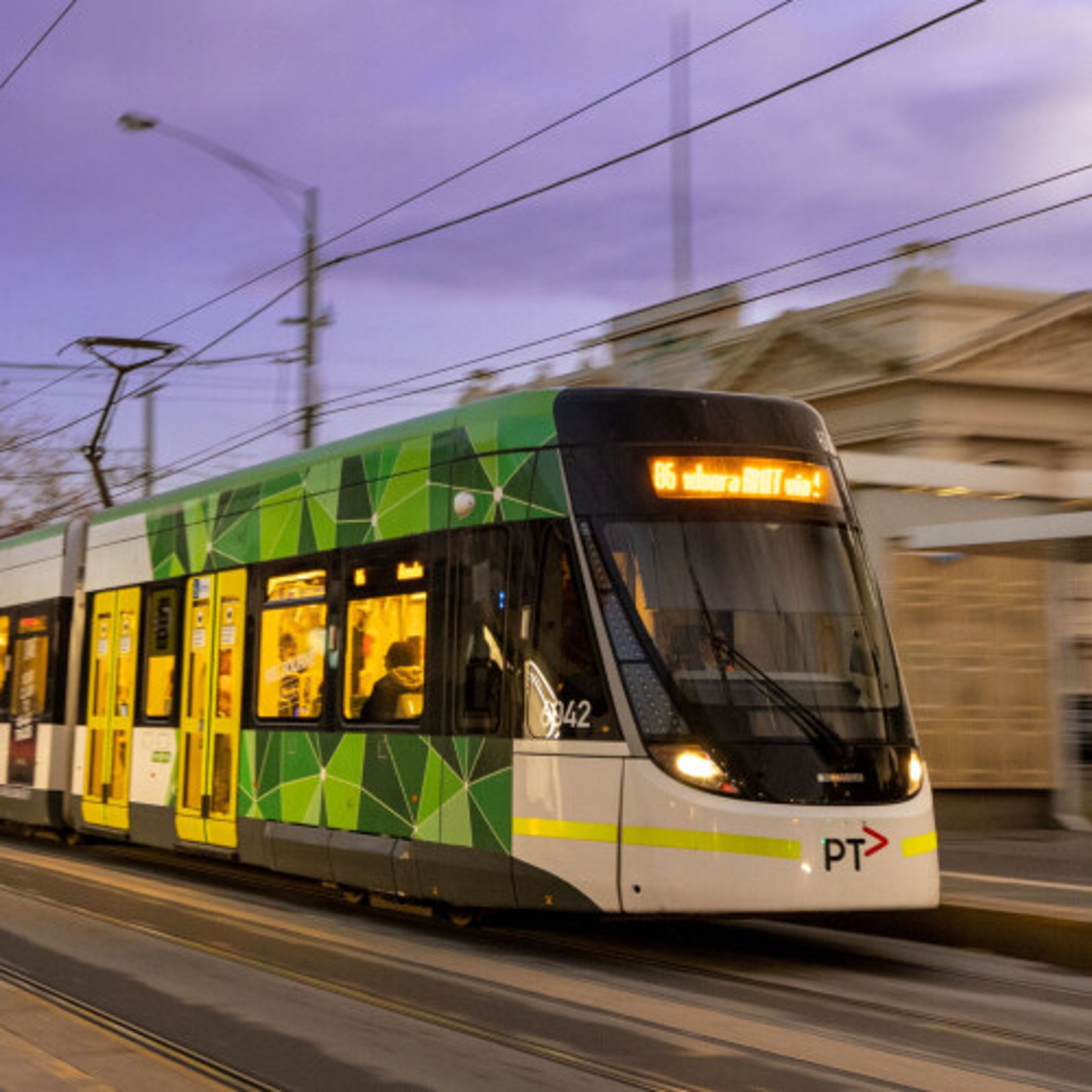 A tram rolling along a Melbourne street