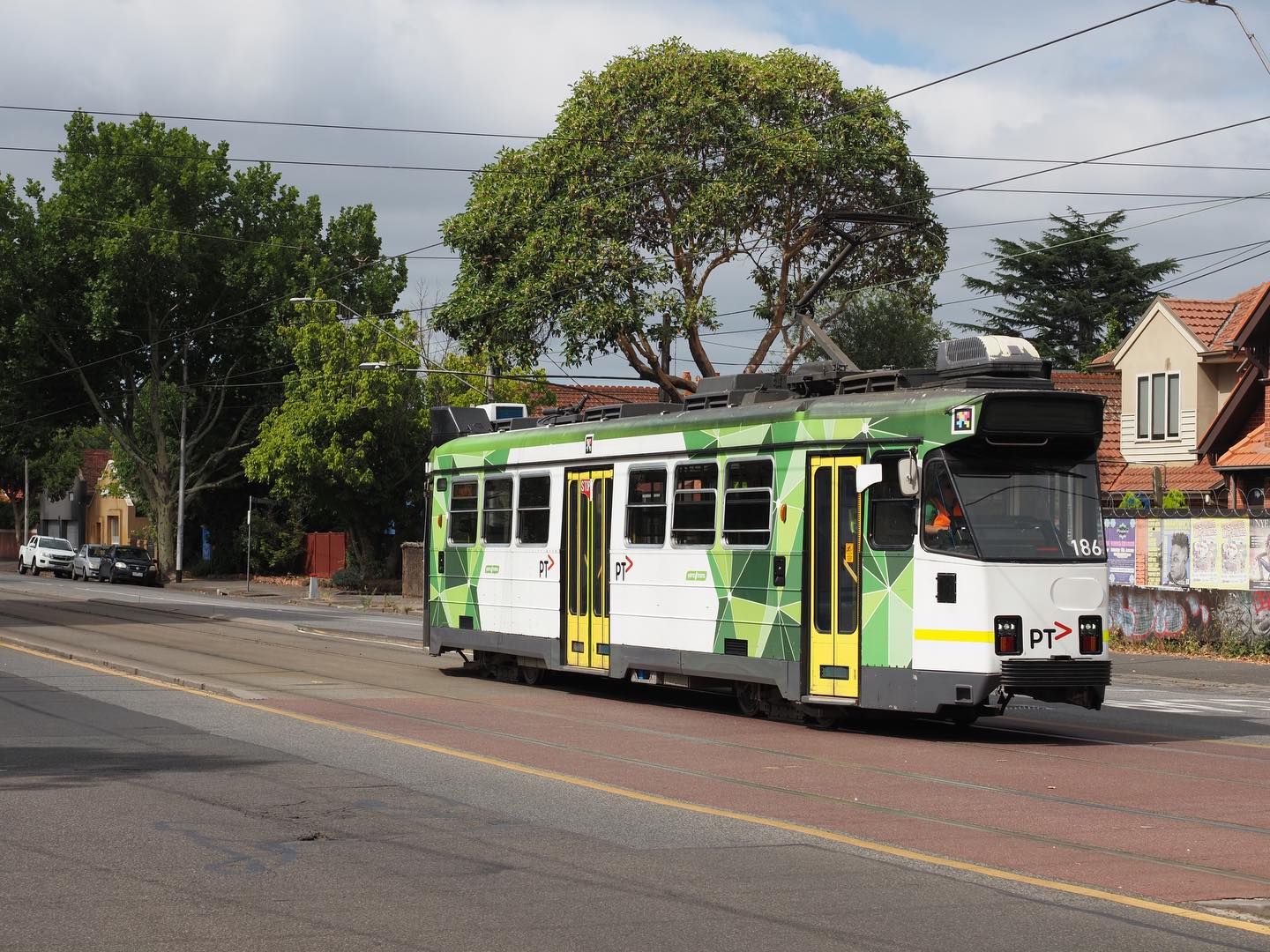 A tram rolling along a Melbourne street