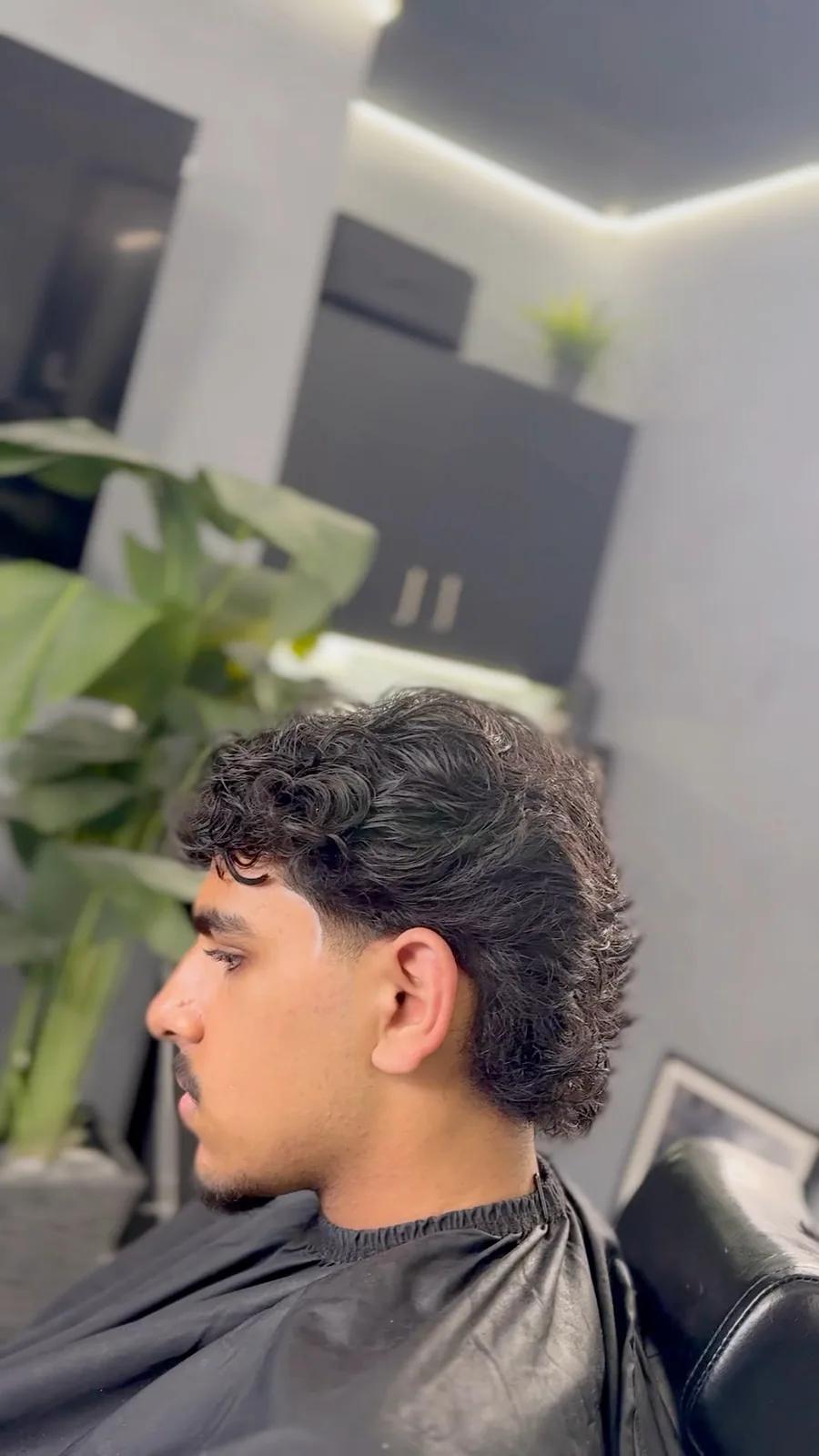 Textured curly mullet at Chair and Blade