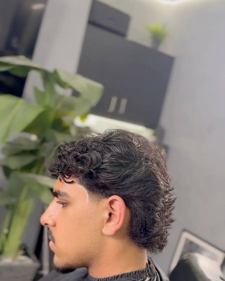 Textured curly mullet at Chair and Blade