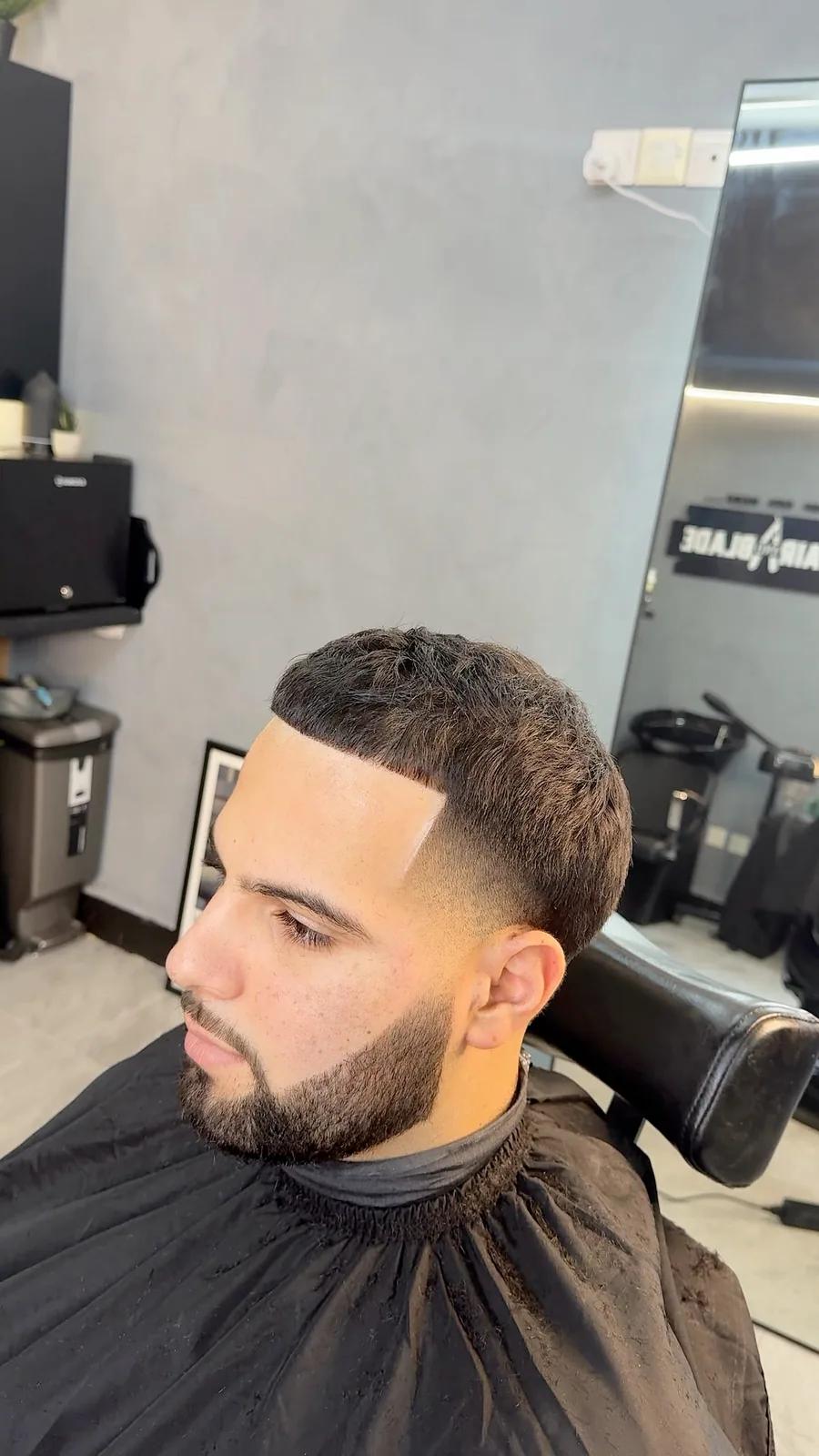 Textured buzz cut with a skin fade at Chair and Blade