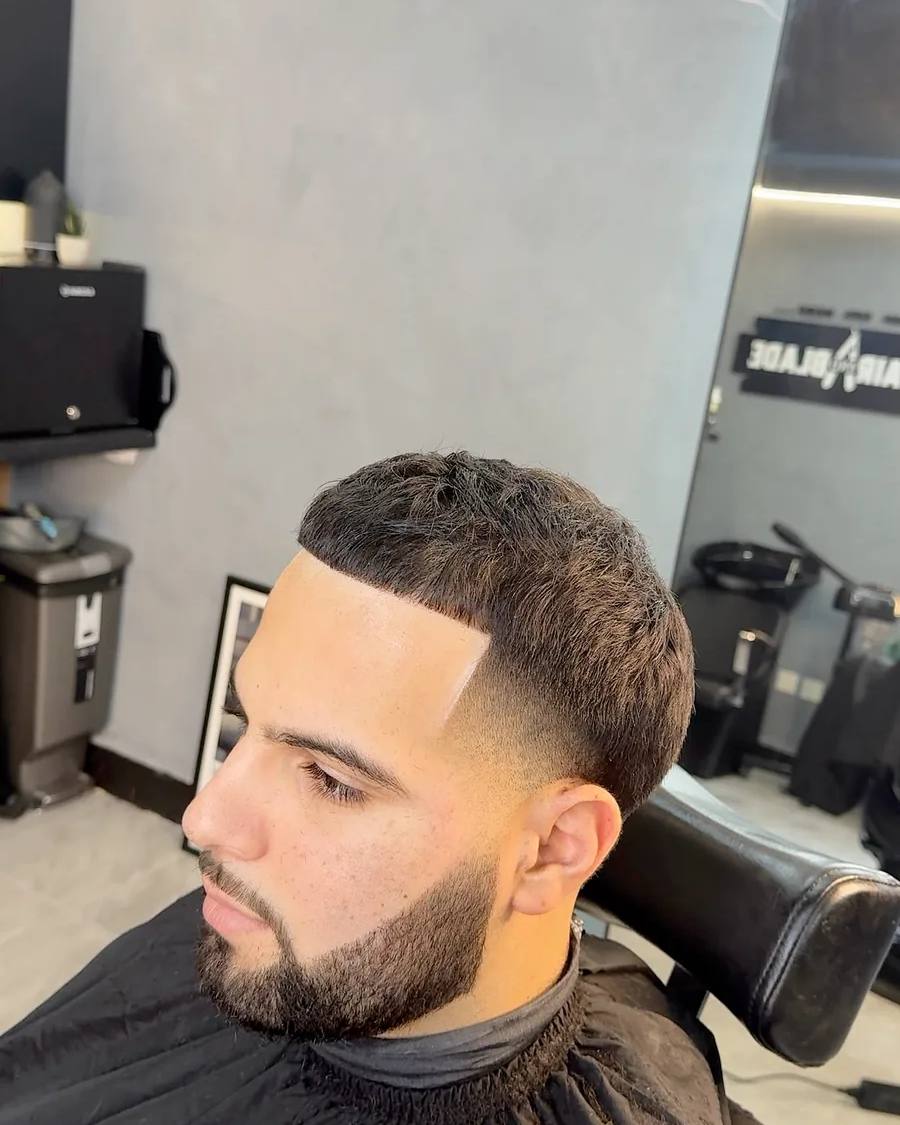 Textured buzz cut with a skin fade at Chair and Blade