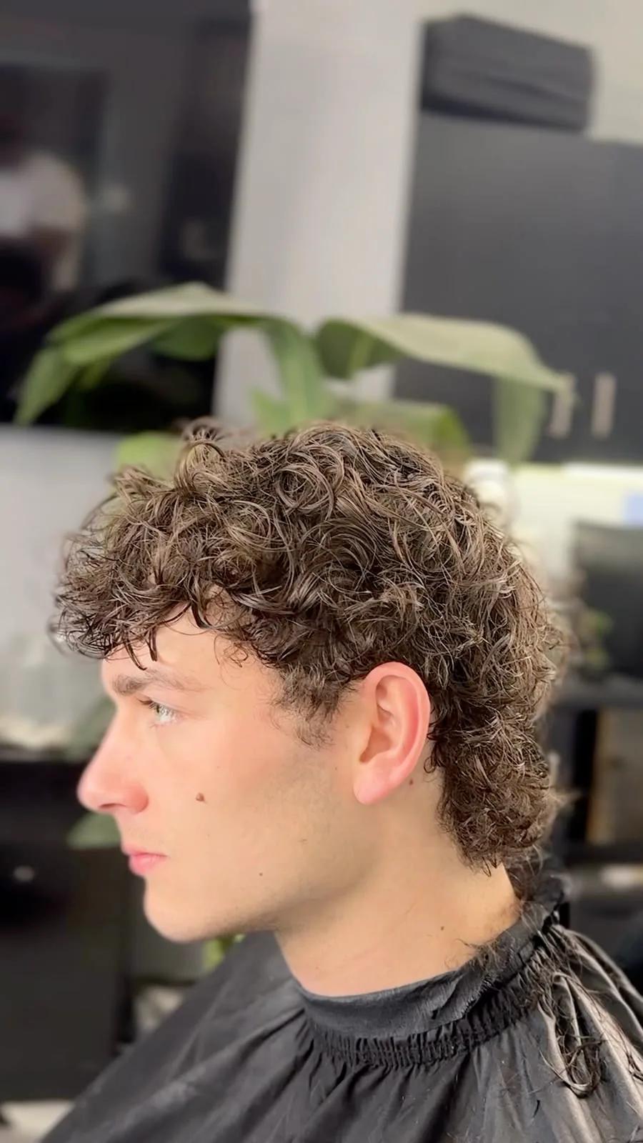 Curly layered perm at Chair and Blade