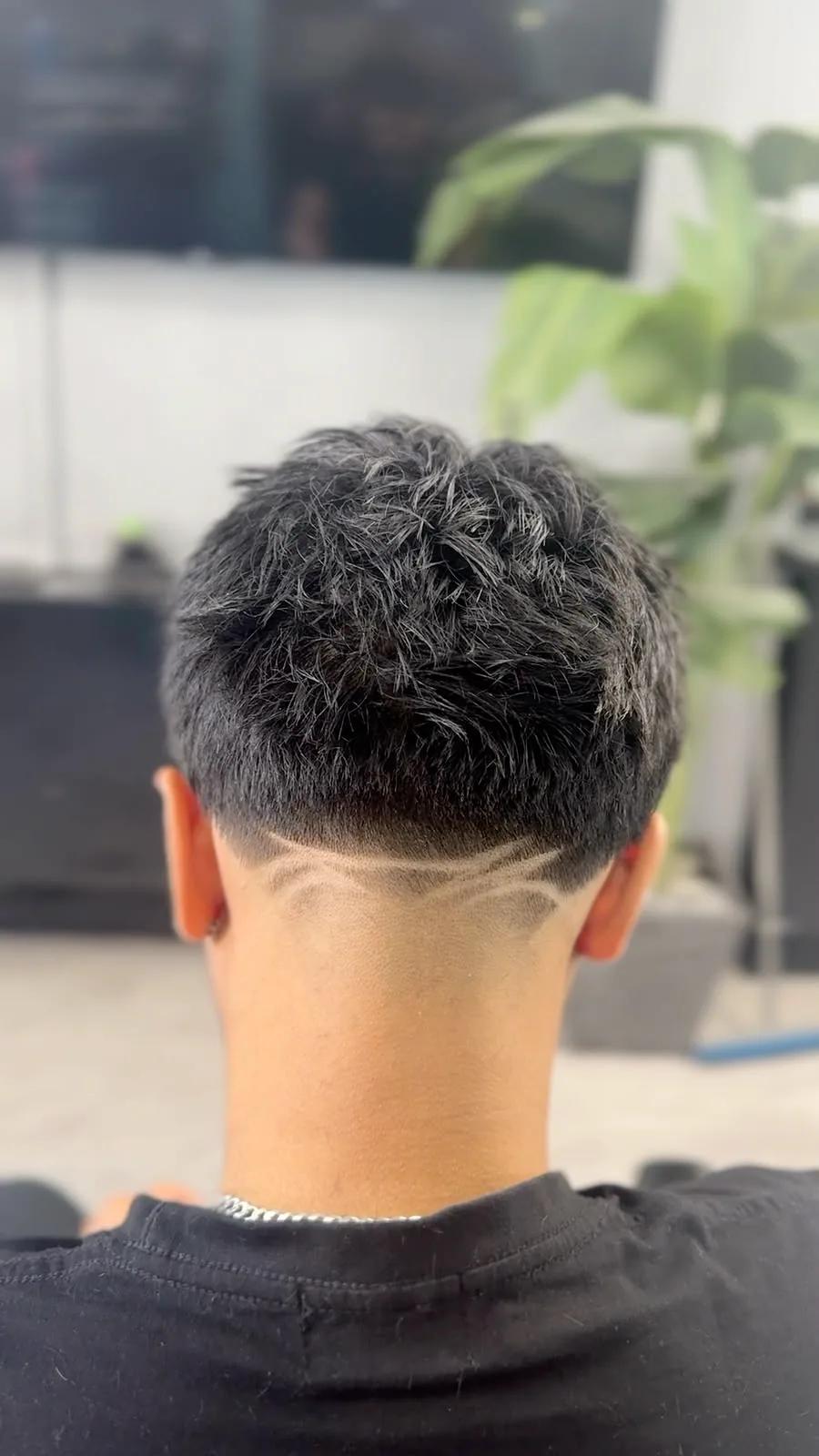 Shaved line design at the nape at Chair and Blade