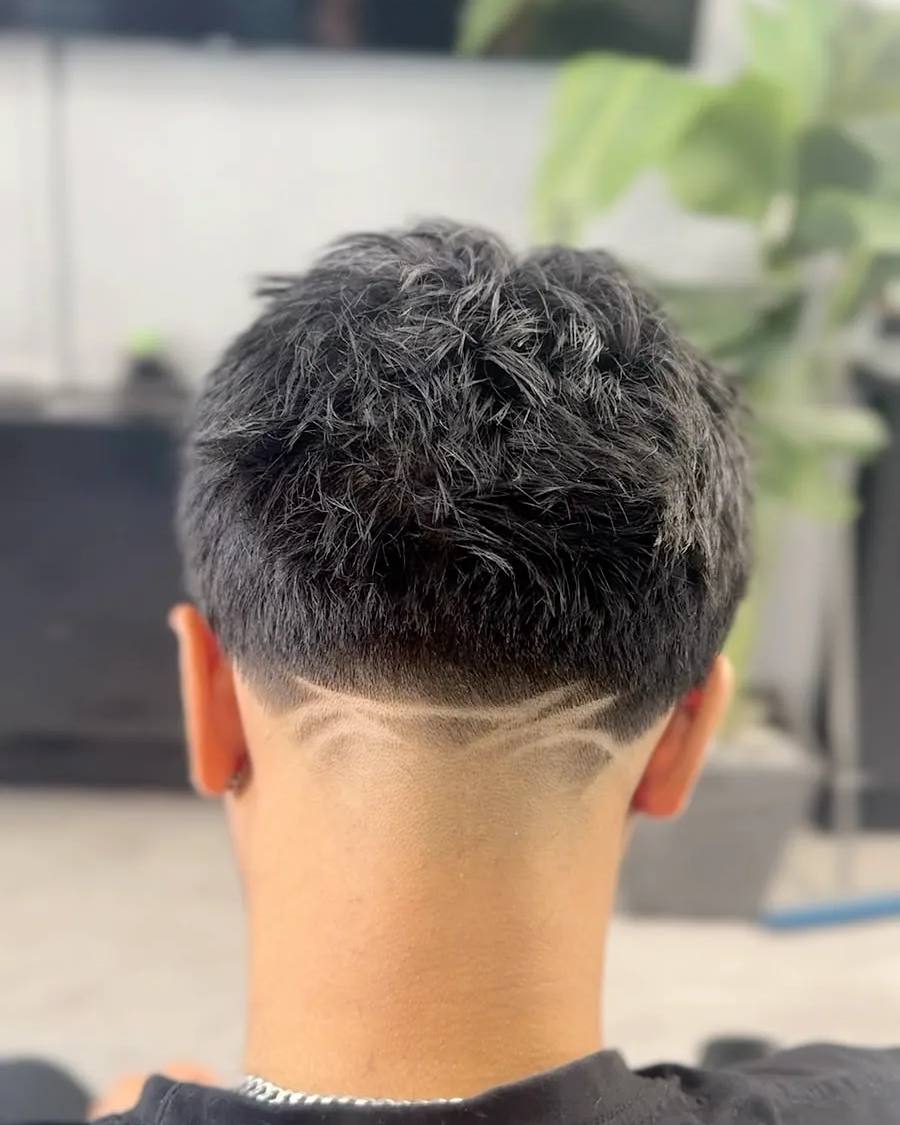 Shaved line design at the nape at Chair and Blade