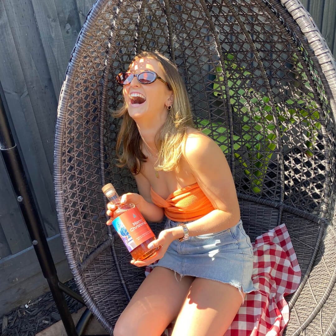 Couple toasting with personalised gifts