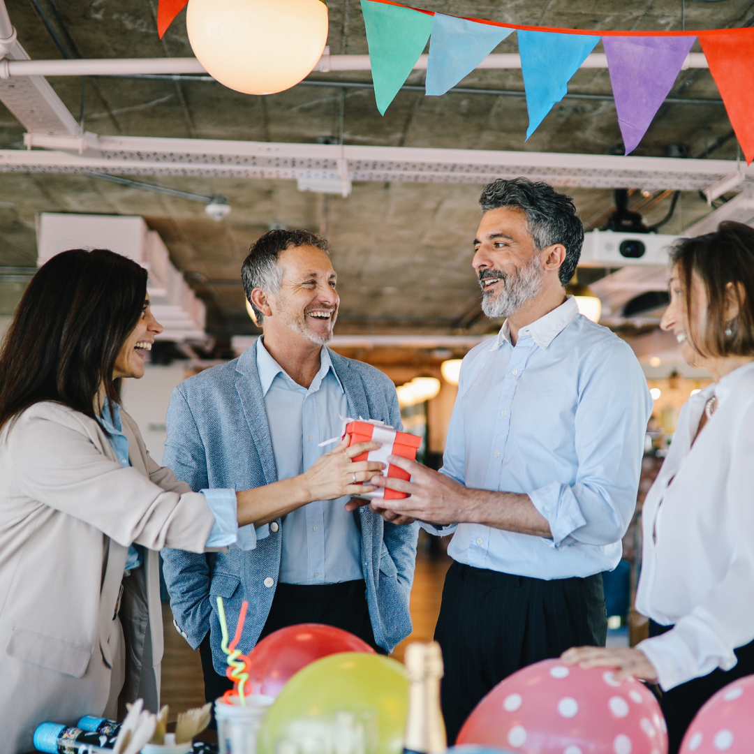 men receiving a birthday gift