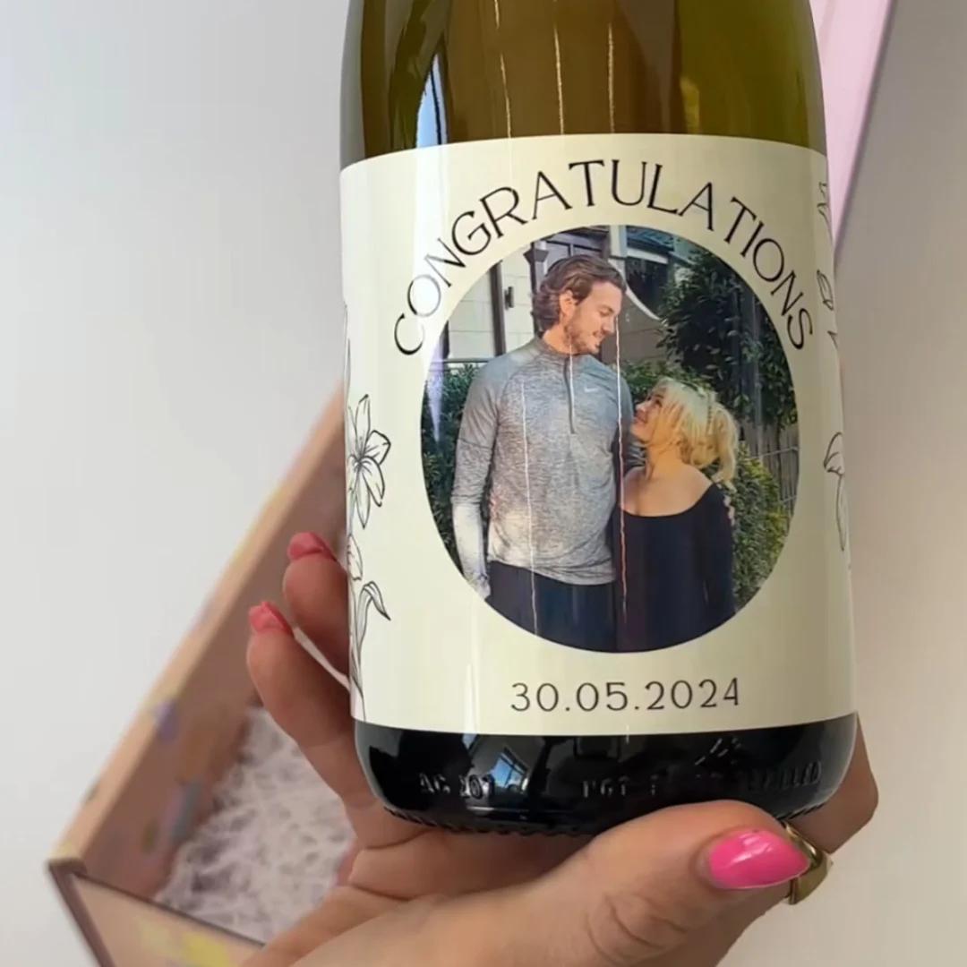 Happy customer holding personalised gin