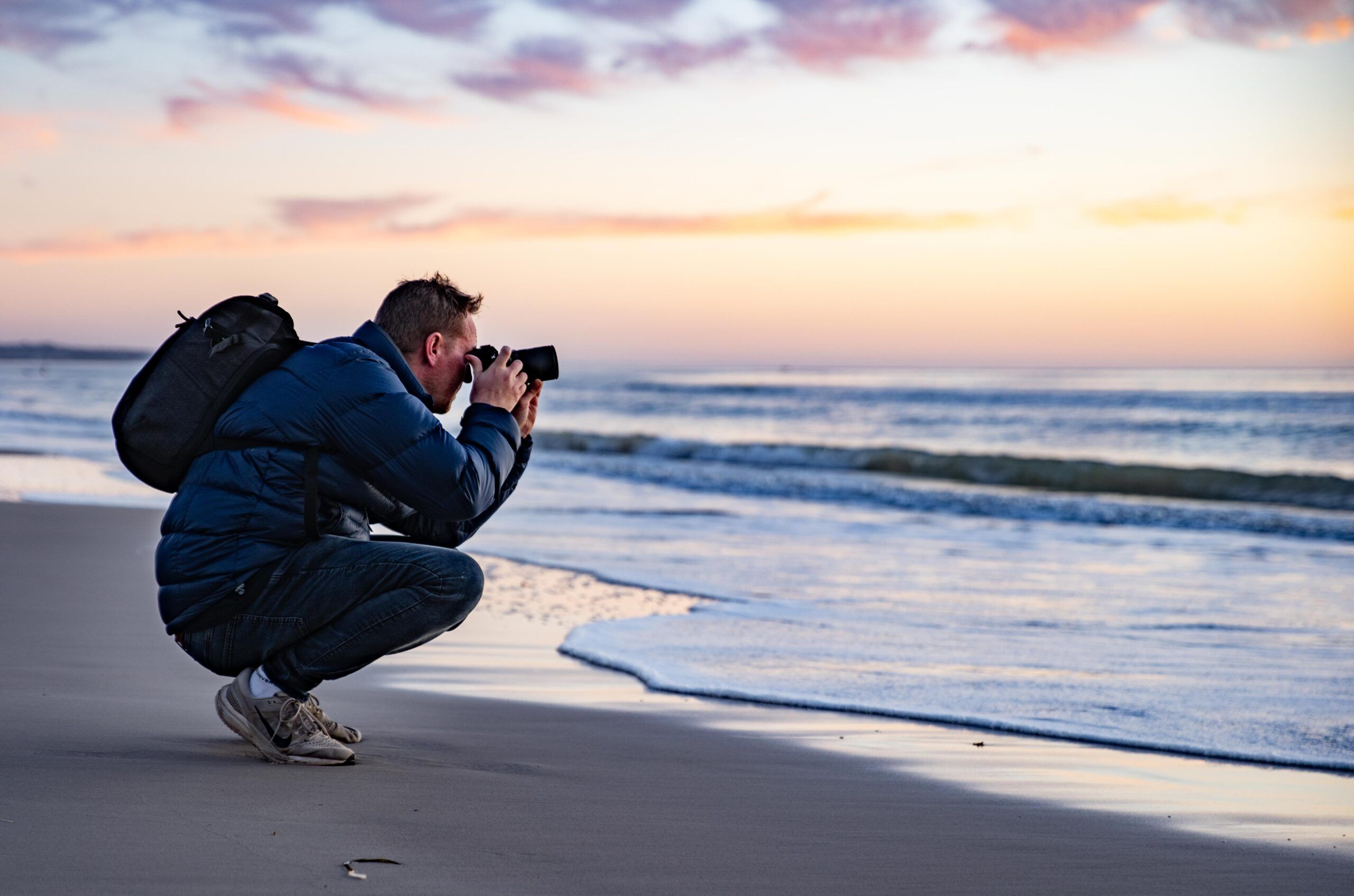 Man taking photo of sunset