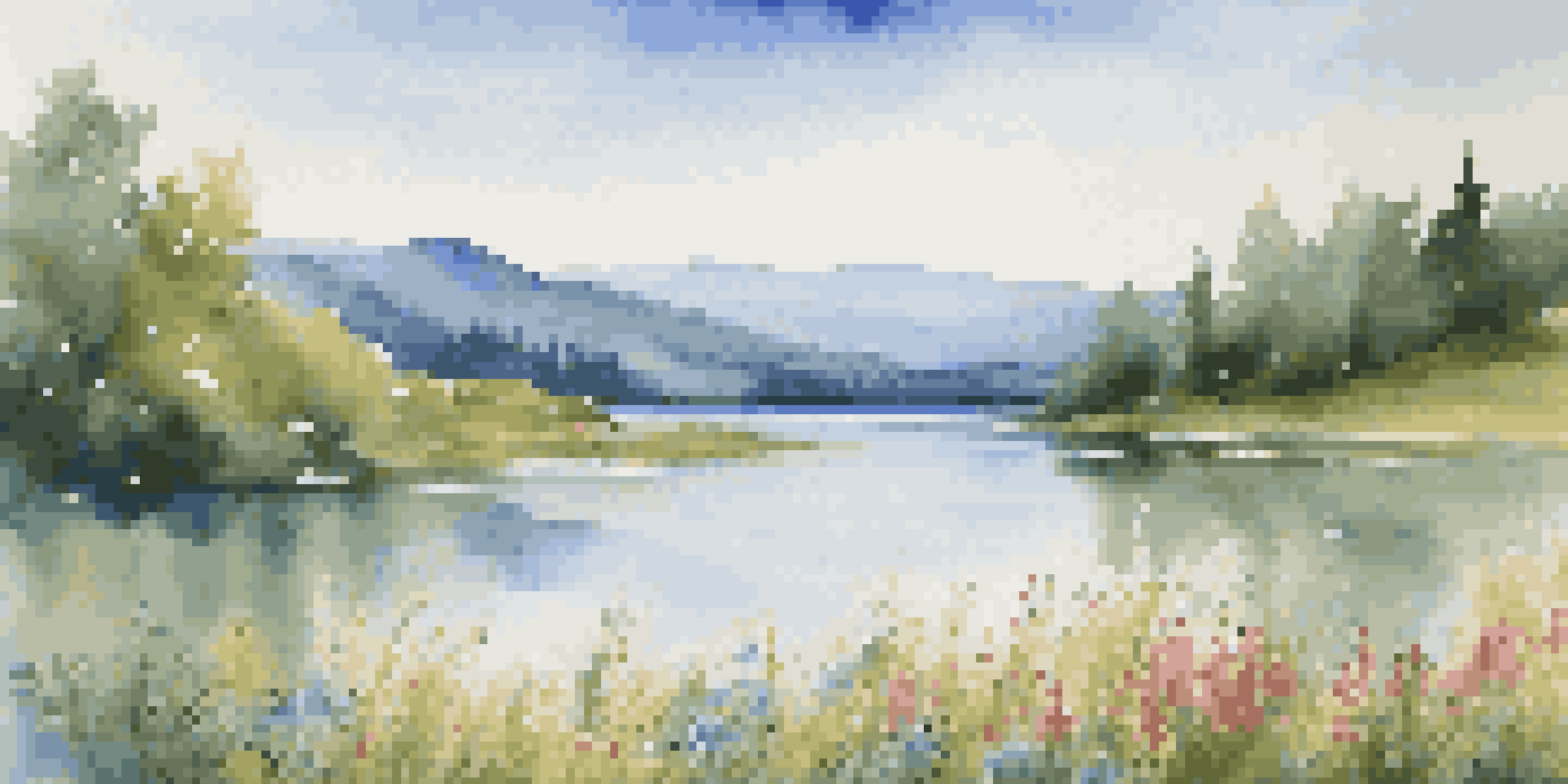 A peaceful lake scene with mountains in the background and colorful wildflowers in the foreground.