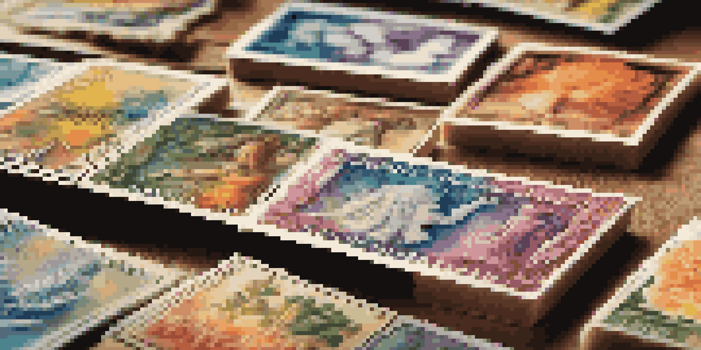 A close-up view of a colorful collection of stamps on a wooden table, illuminated by soft natural light.