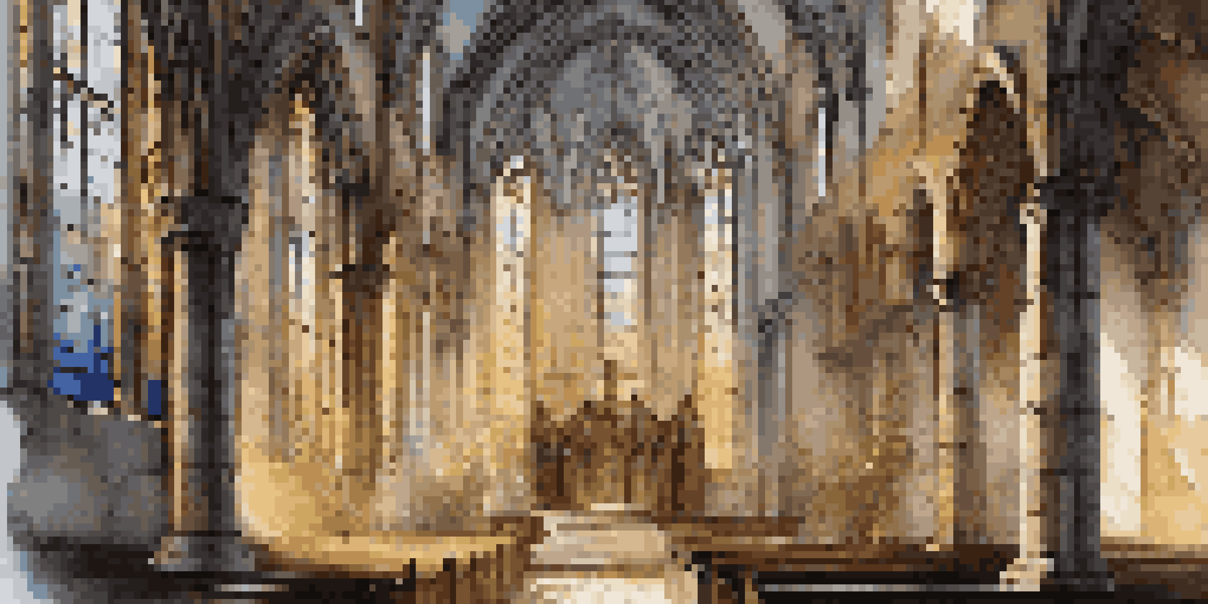 Interior of an abandoned Gothic church with stained glass windows, sunlight filtering through, and vines on stone walls.