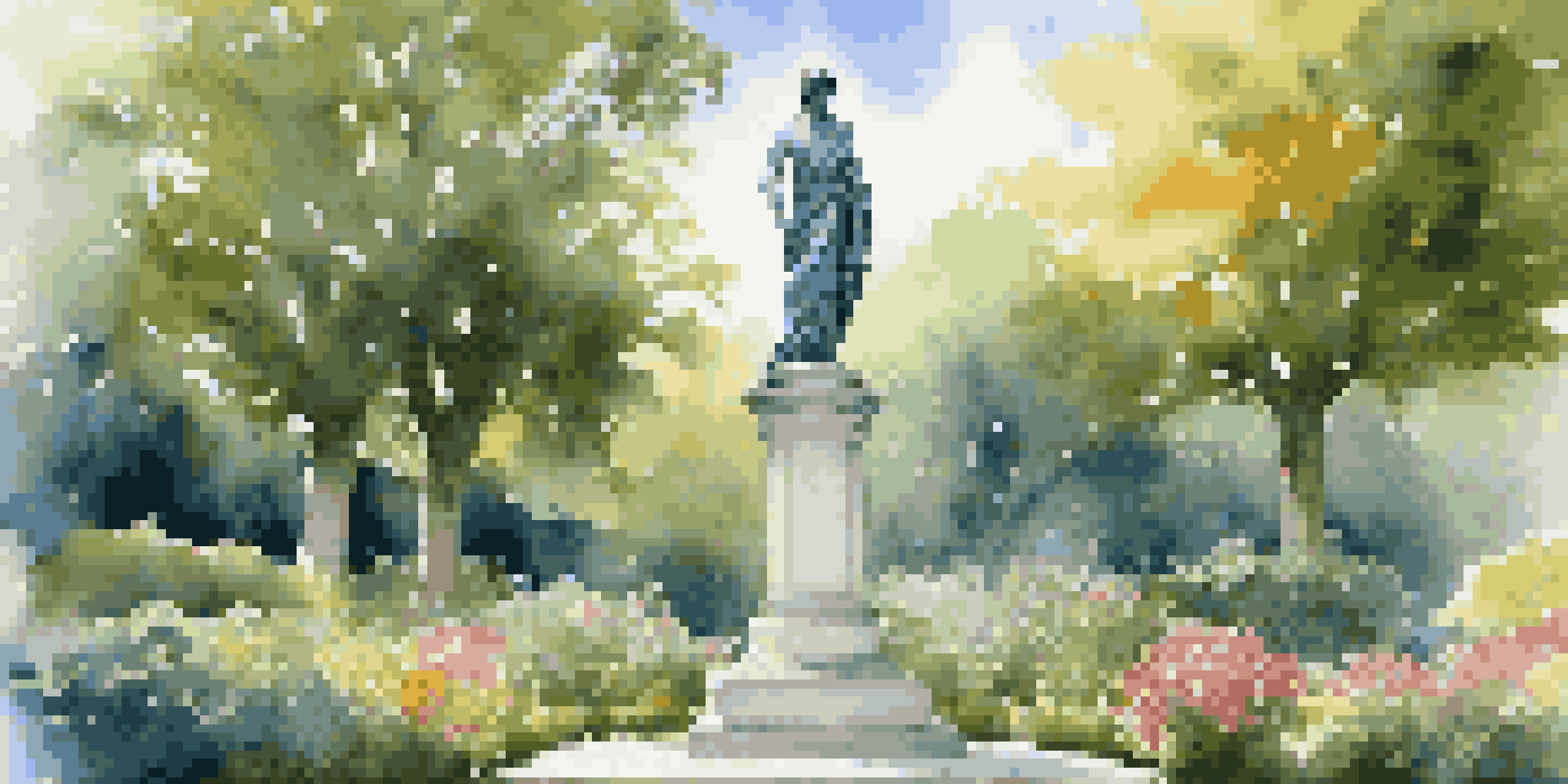 A marble statue in an outdoor park, surrounded by greenery and colorful flowers, under a clear blue sky.