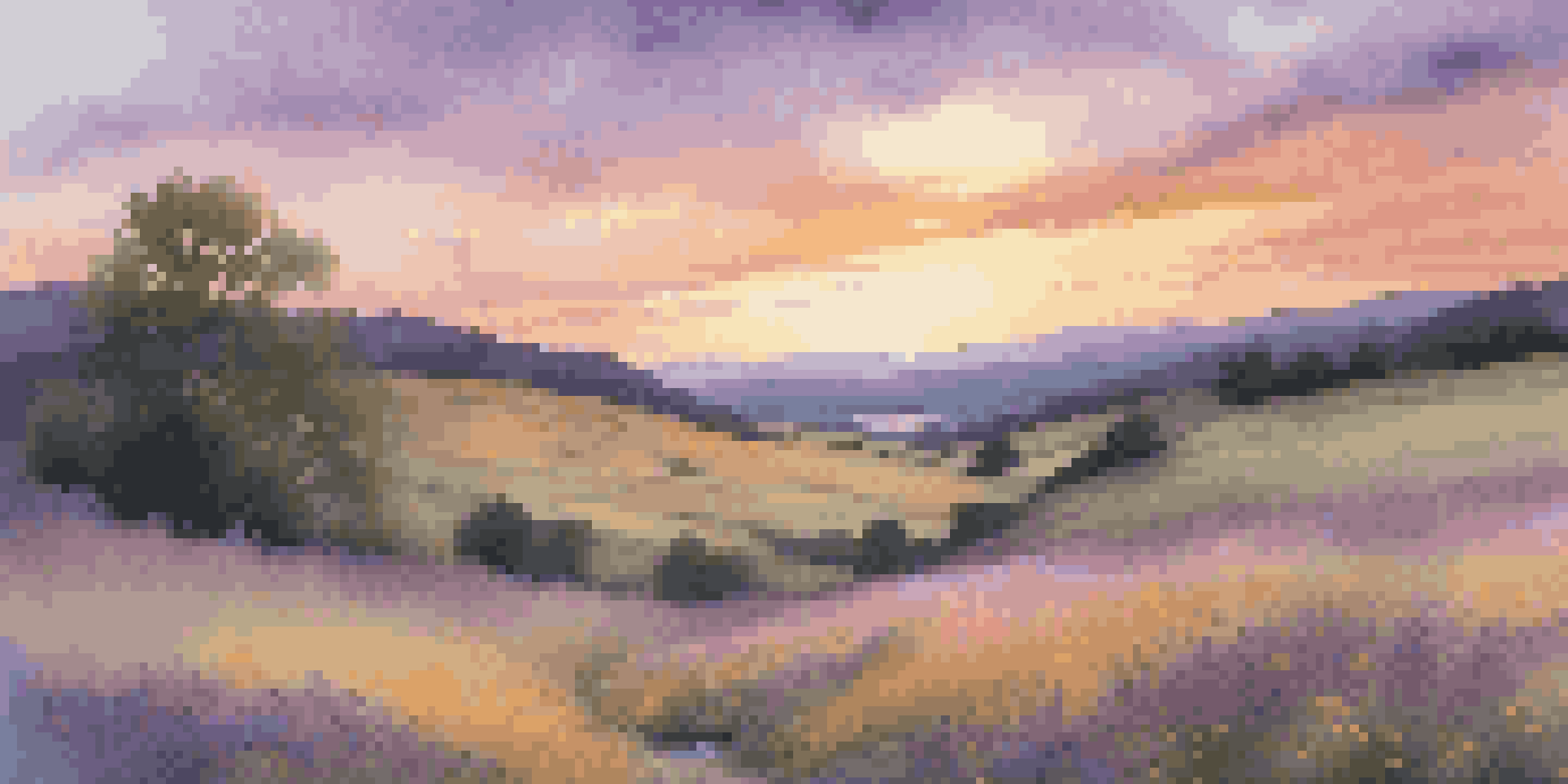 A picturesque landscape with a vibrant sunset, rolling hills, and colorful wildflowers near a reflective stream.