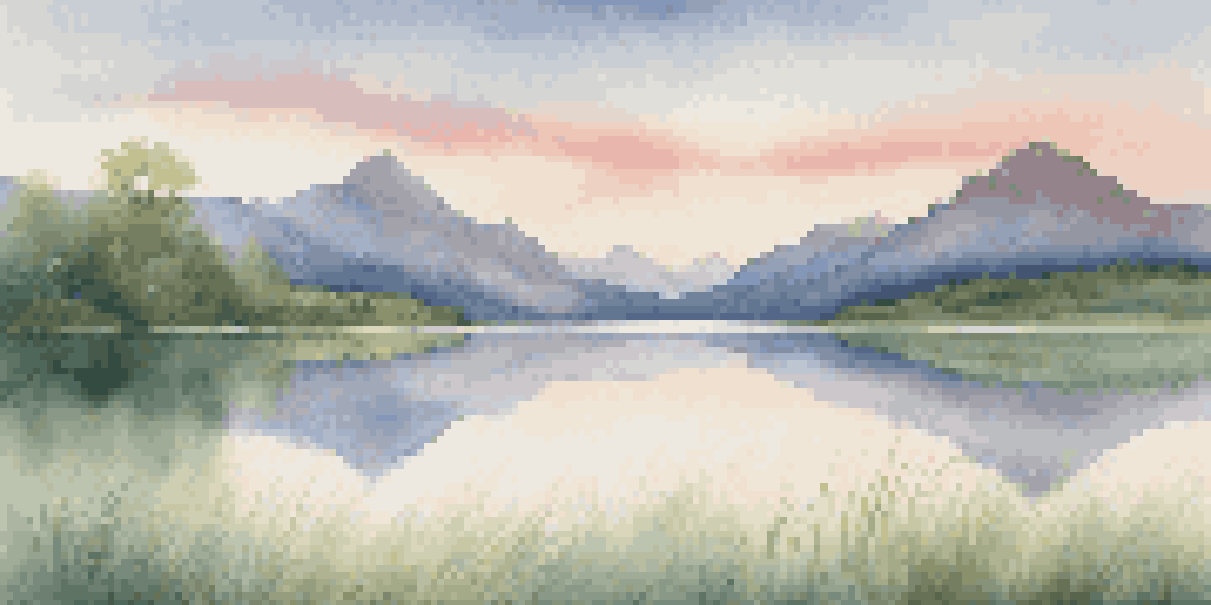 A peaceful mountain landscape with a perfect reflection on a lake during sunrise, featuring soft pastel colors in the sky and green grass in the foreground.