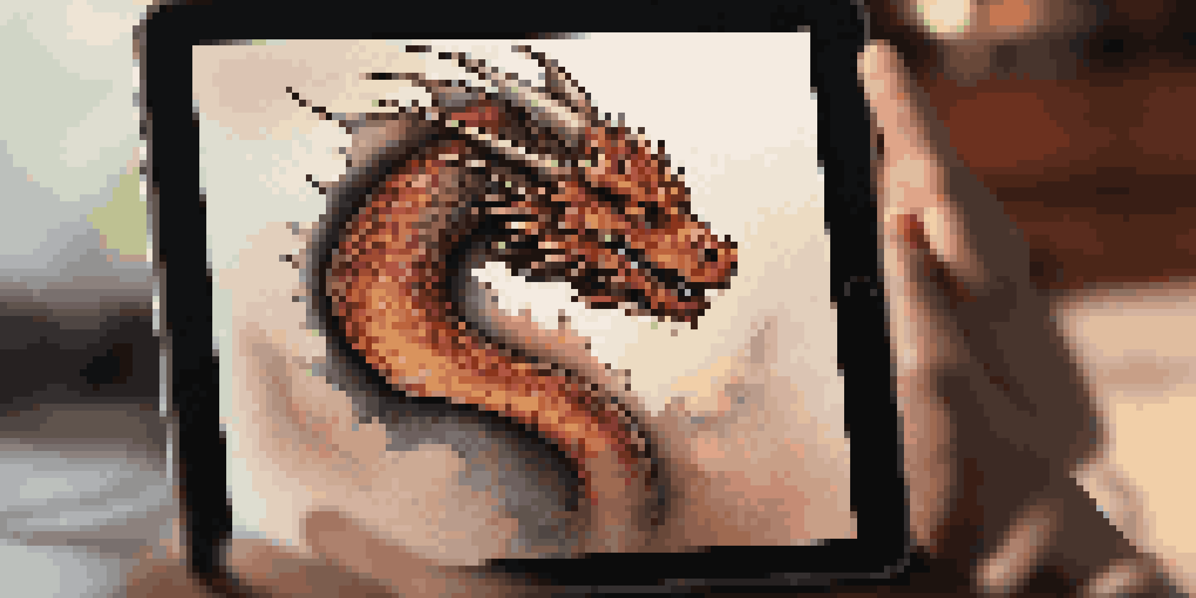 A close-up of a lifelike 3D dragon tattoo design displayed on a tablet, showcasing intricate details.