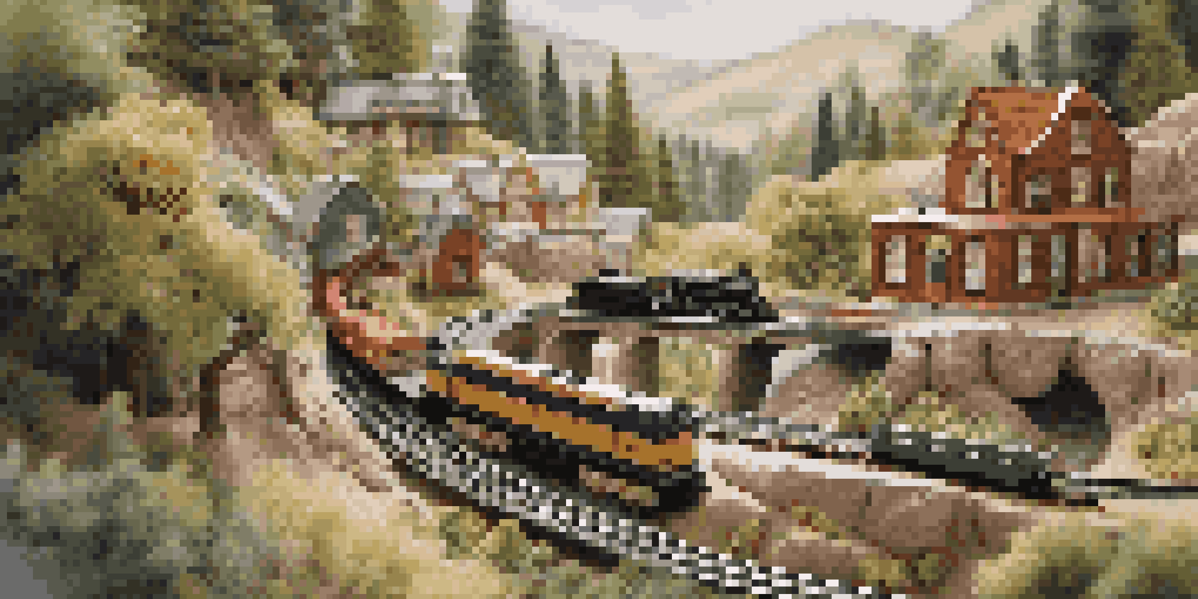 A detailed view of a model railroad with miniature landscapes, train models, and vibrant scenery.