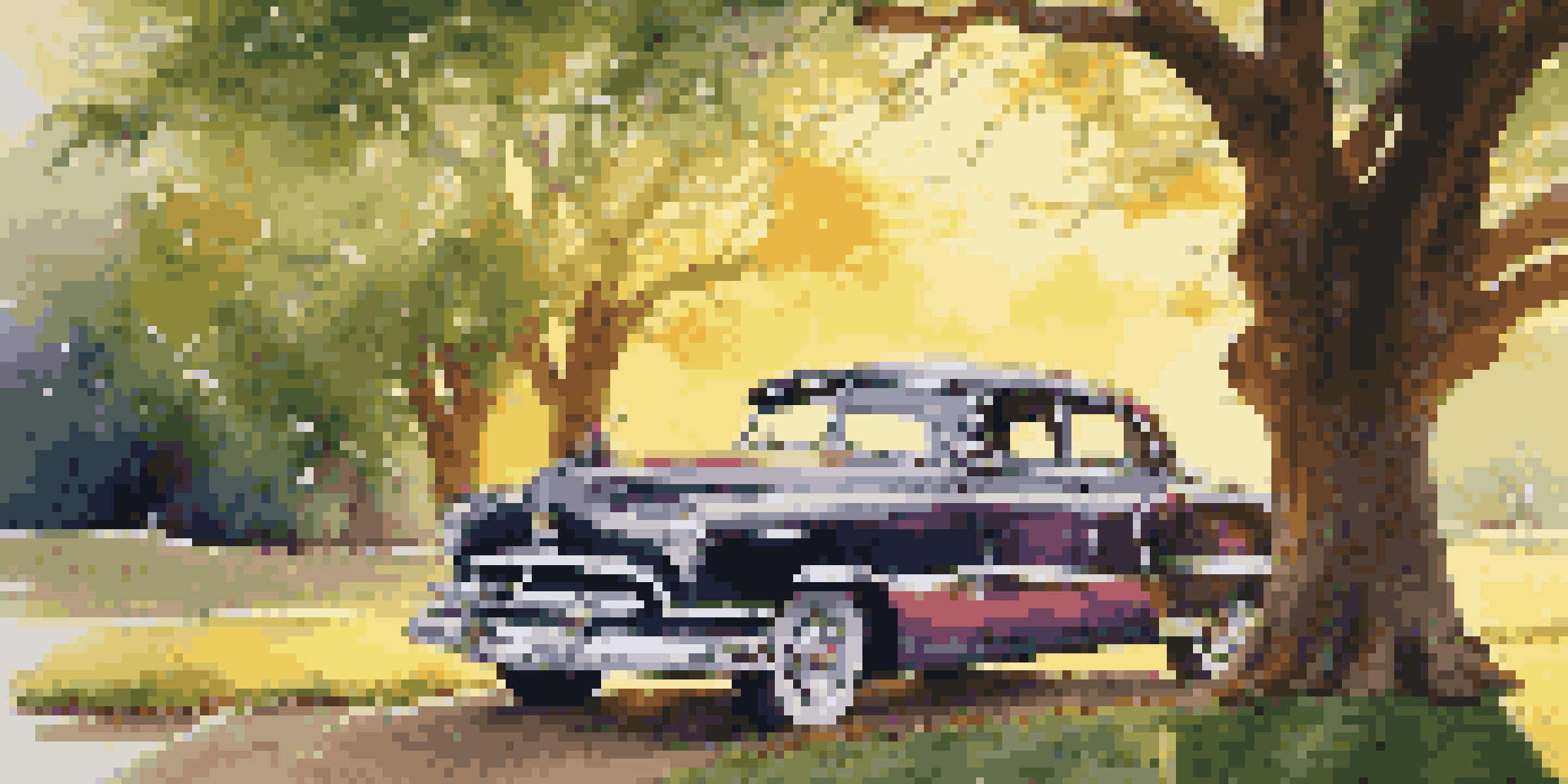A restored classic car parked under a tree during sunset, surrounded by greenery.