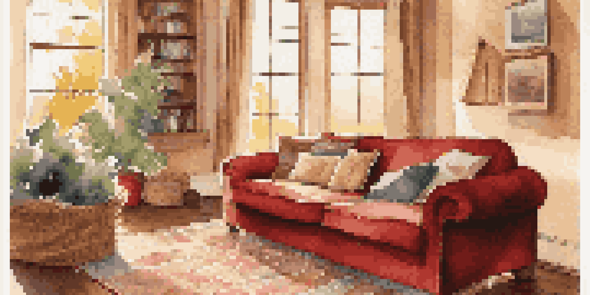 A warm and inviting living room with a red sofa, knit blanket, and sunlight streaming through a large window.