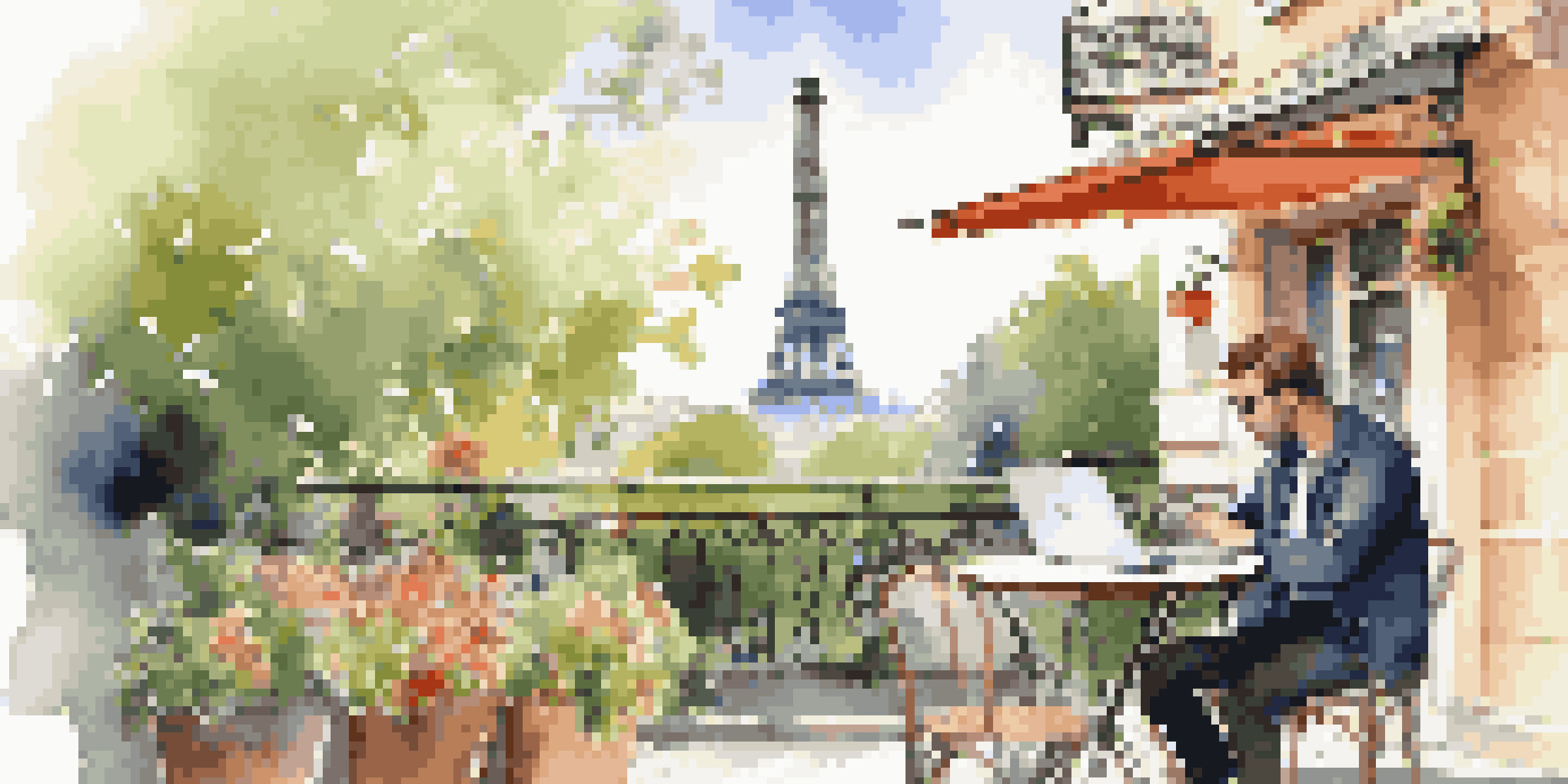A traveler enjoying coffee at a café in Paris, with a laptop open on the table, surrounded by flowers and sunlight, and the Eiffel Tower in the background.