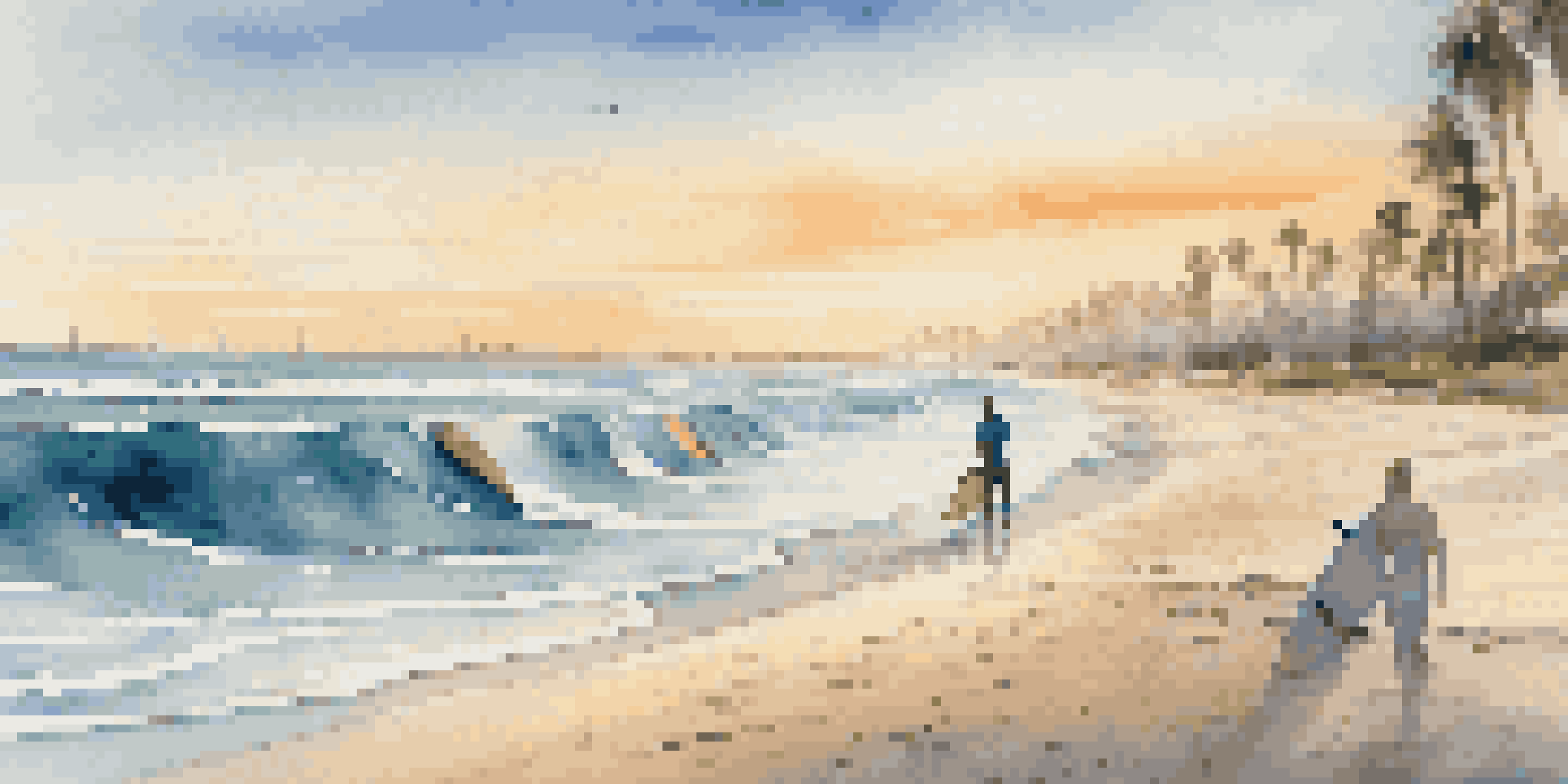 A colorful array of surfboards on a sandy beach during sunrise, with gentle ocean waves and palm trees in the background.