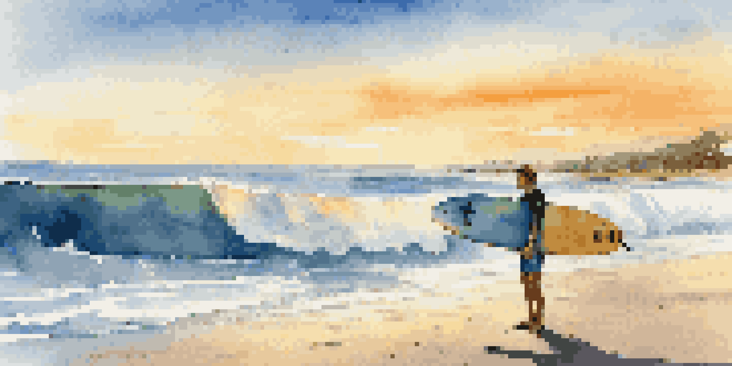A beginner surfer with a colorful longboard on the beach during sunset, looking excited.