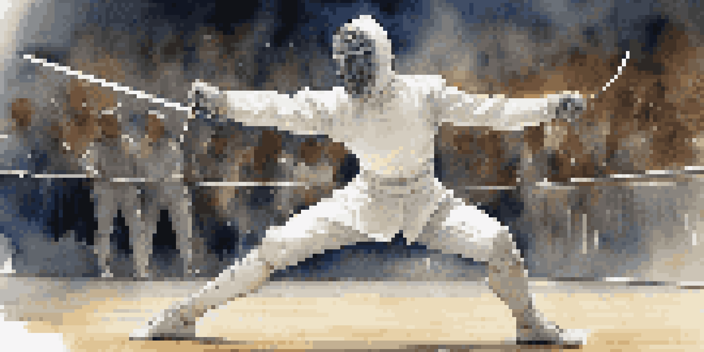 A fencer lunging on a strip, wearing a white uniform and mask, with a cheering audience in the blurred background.