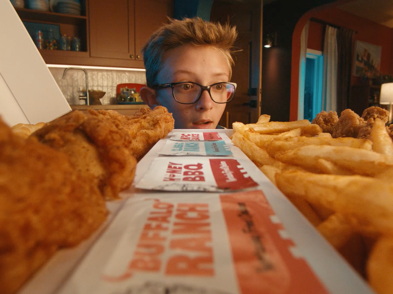 Young boy wide-eyed at KFC Fill Up Box