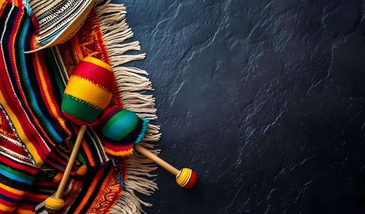 Maracas laying on a traditional blanket