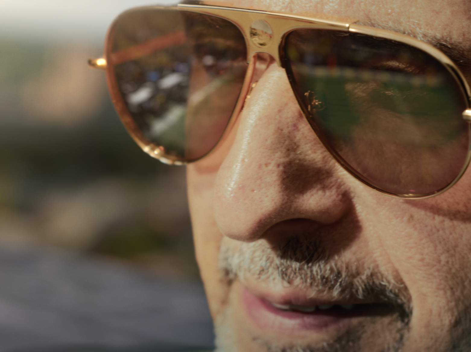 Close-up shot of John Turturro in sunglasses