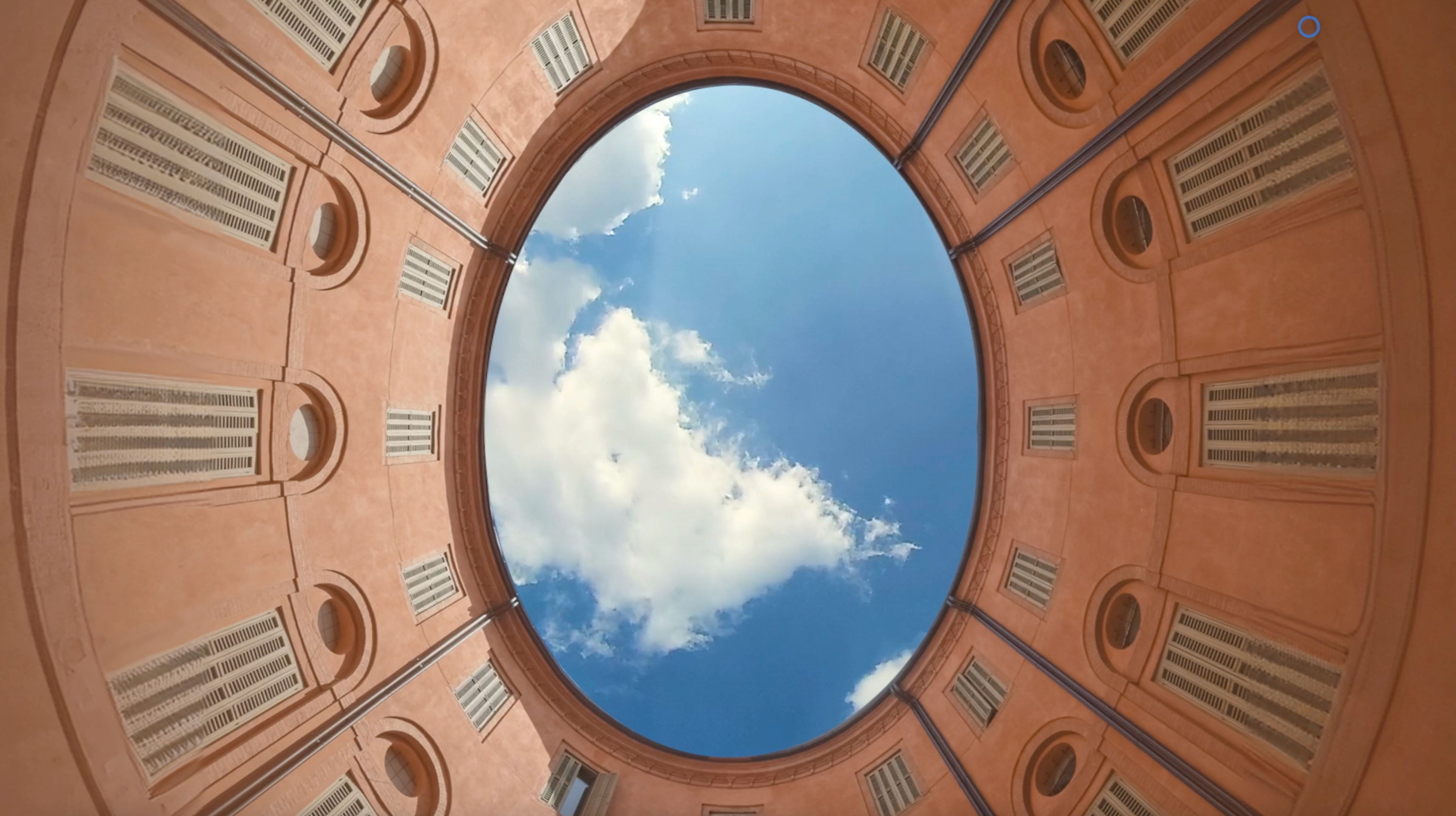Egg-shaped view of ceiling and sky