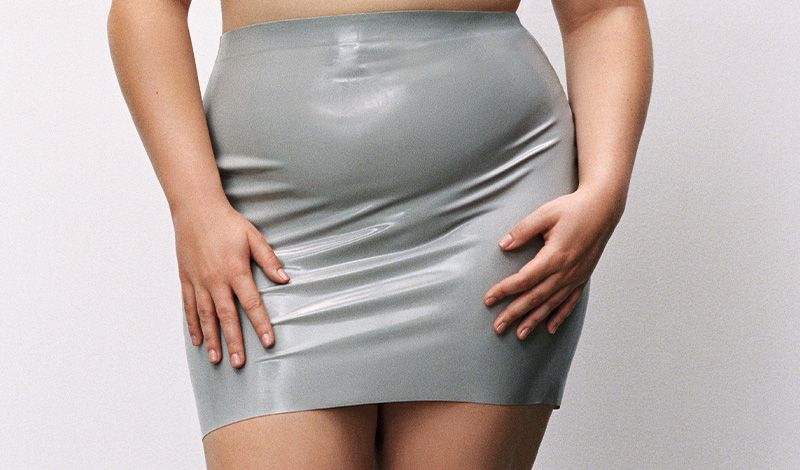 A model wears latex mini skirt