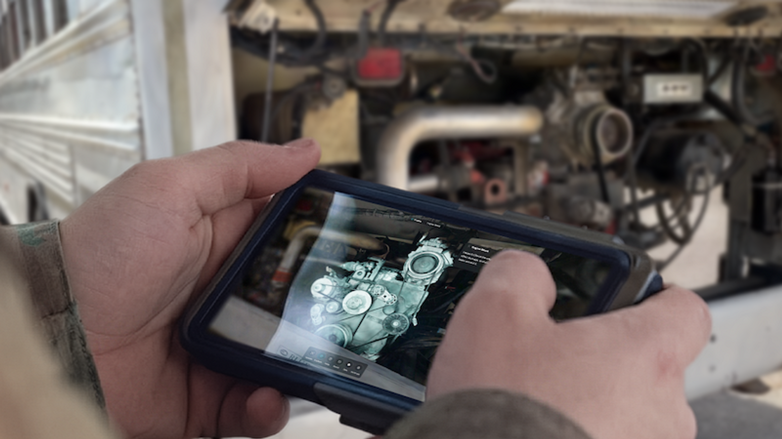 Maintainer looking at 3D model on tablet