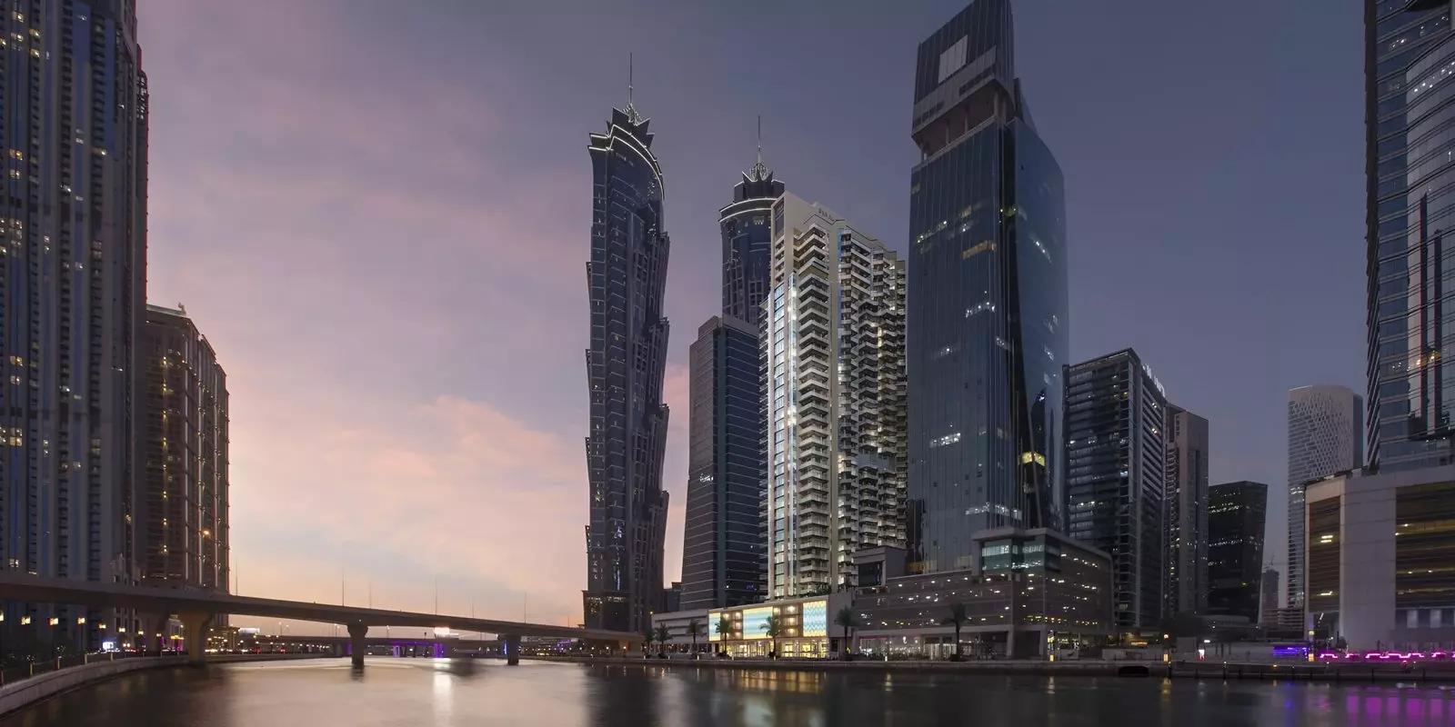 Urban Oasis by Missoni residential facade with canal and skyline backdrop, Business Bay