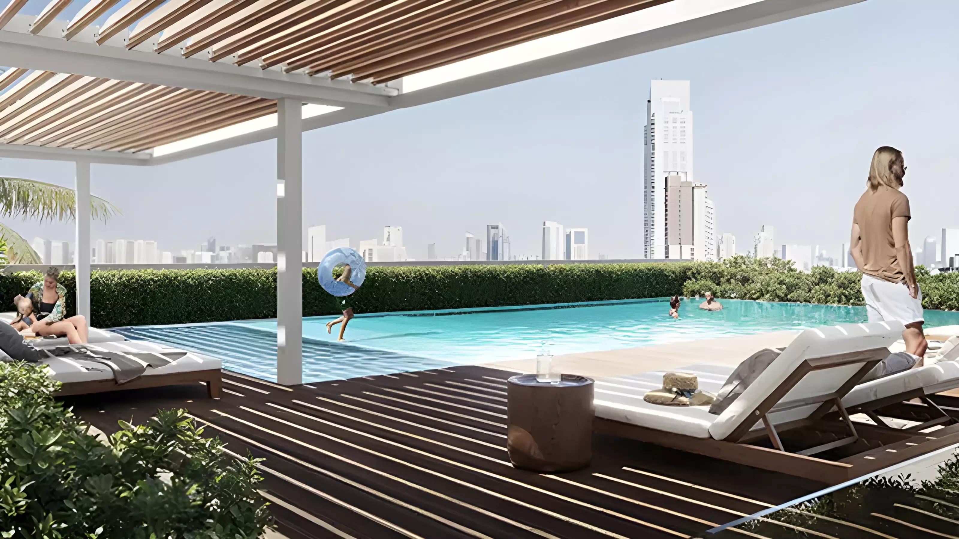 Amenity deck with pool area at V1VID Residence, Dubai