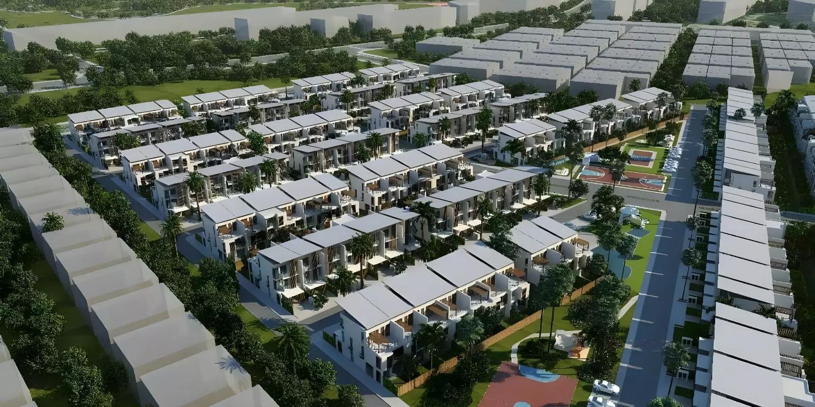 Motor City Hills community street with parked cars and townhouses, Motor City, Dubai