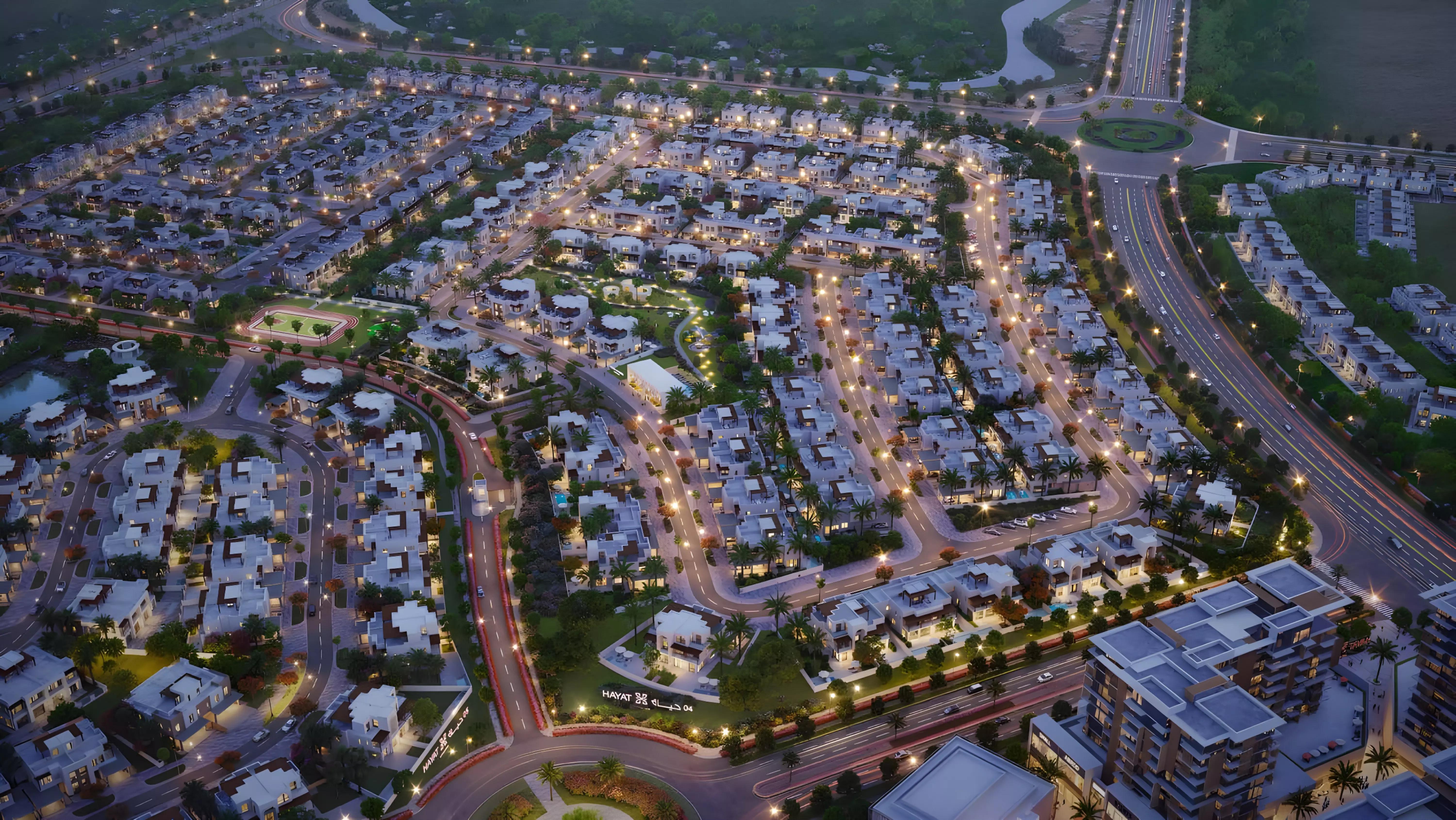 Hayat Phase 4 townhouse street view with driveway and greenery, Dubai South