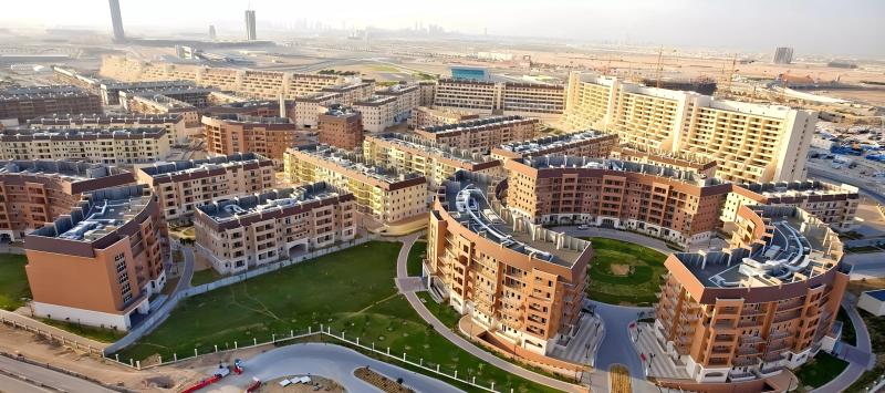 Movenpick Residences exterior render showing the apartment tower in Motor City, Dubai