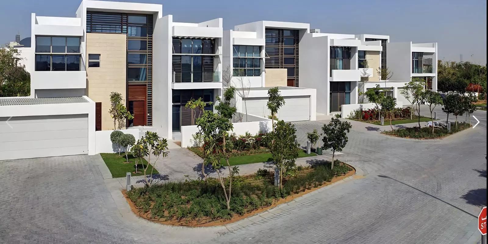 A Villas facade and landscaped front garden, District One, Dubai