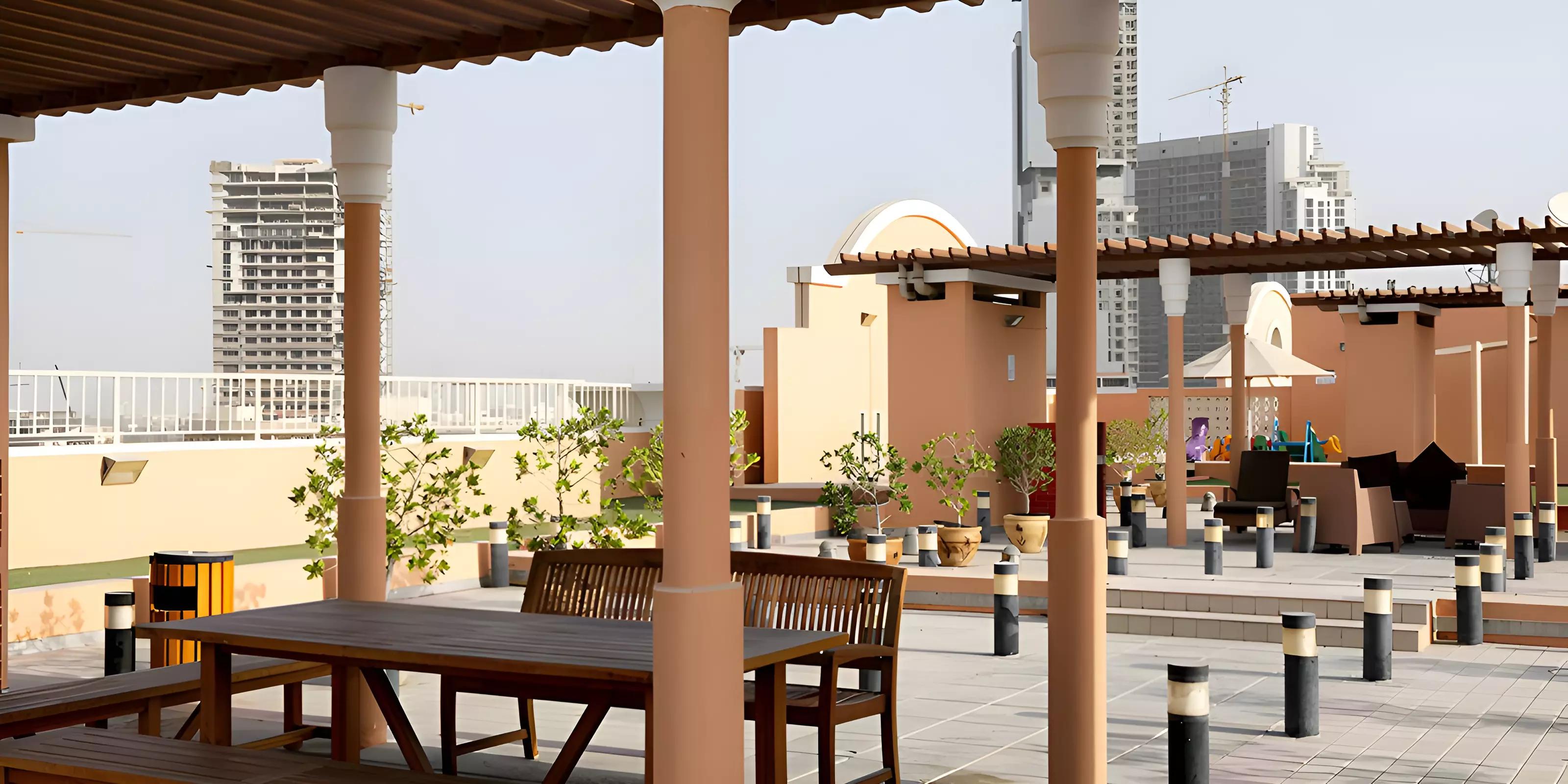 Gardenia 1 residential facade with landscaped surroundings, Jumeirah Village Circle