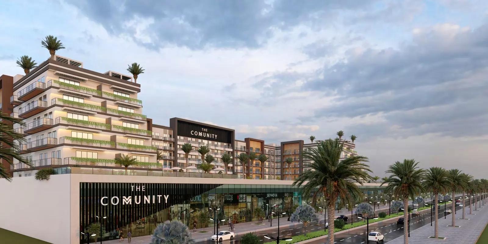 Street-level view of The Community Motor City development, Motor City, Dubai
